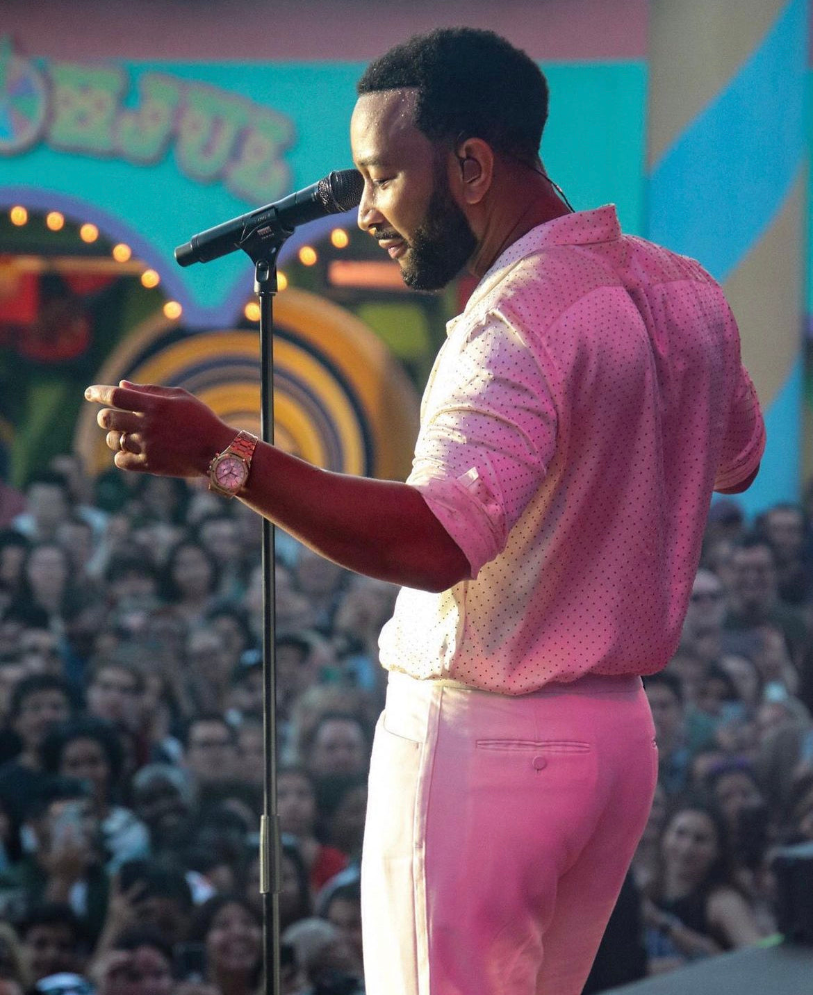 john legend with concert crowd in background