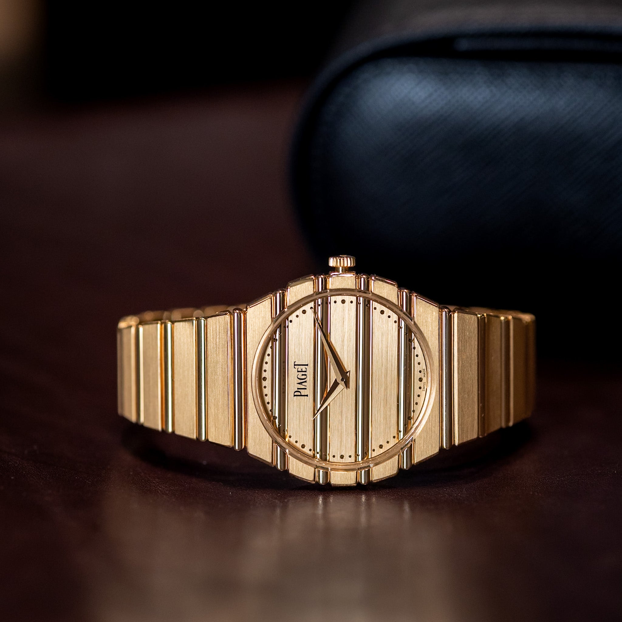 Gold watch with a dark background