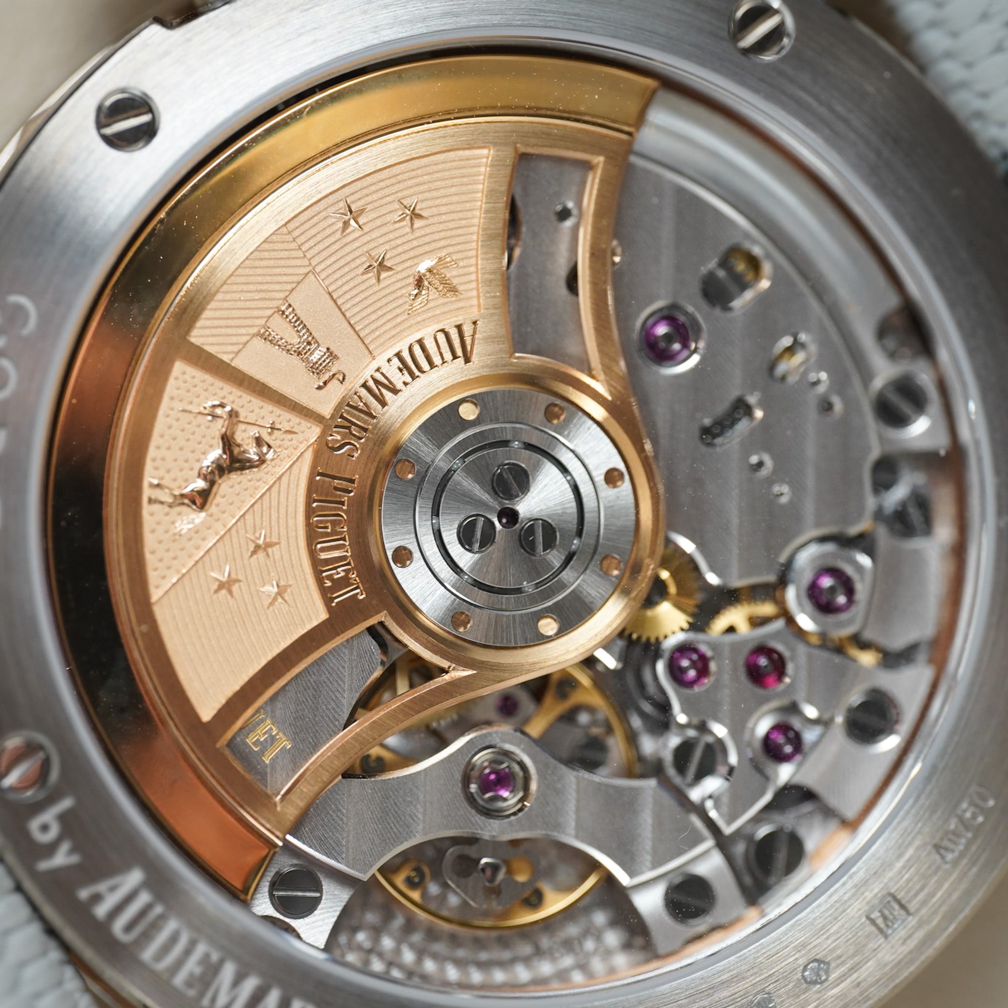 Close-up of a watch mechanism with visible branding