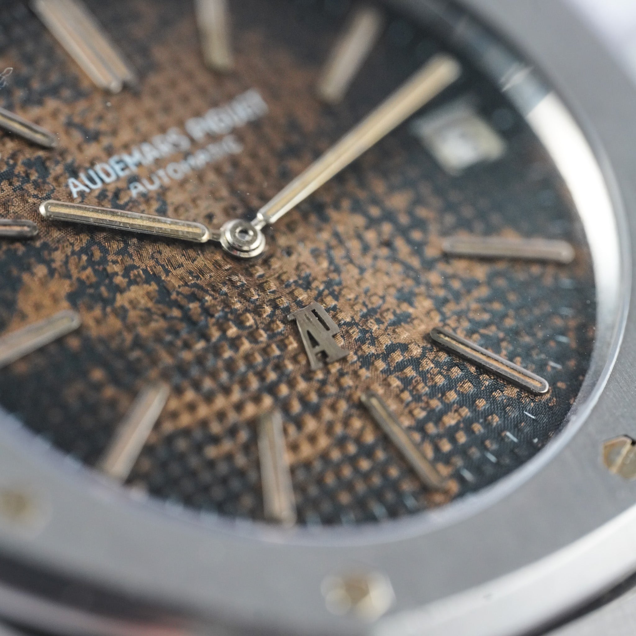 Closeup of a faded brown watch dial