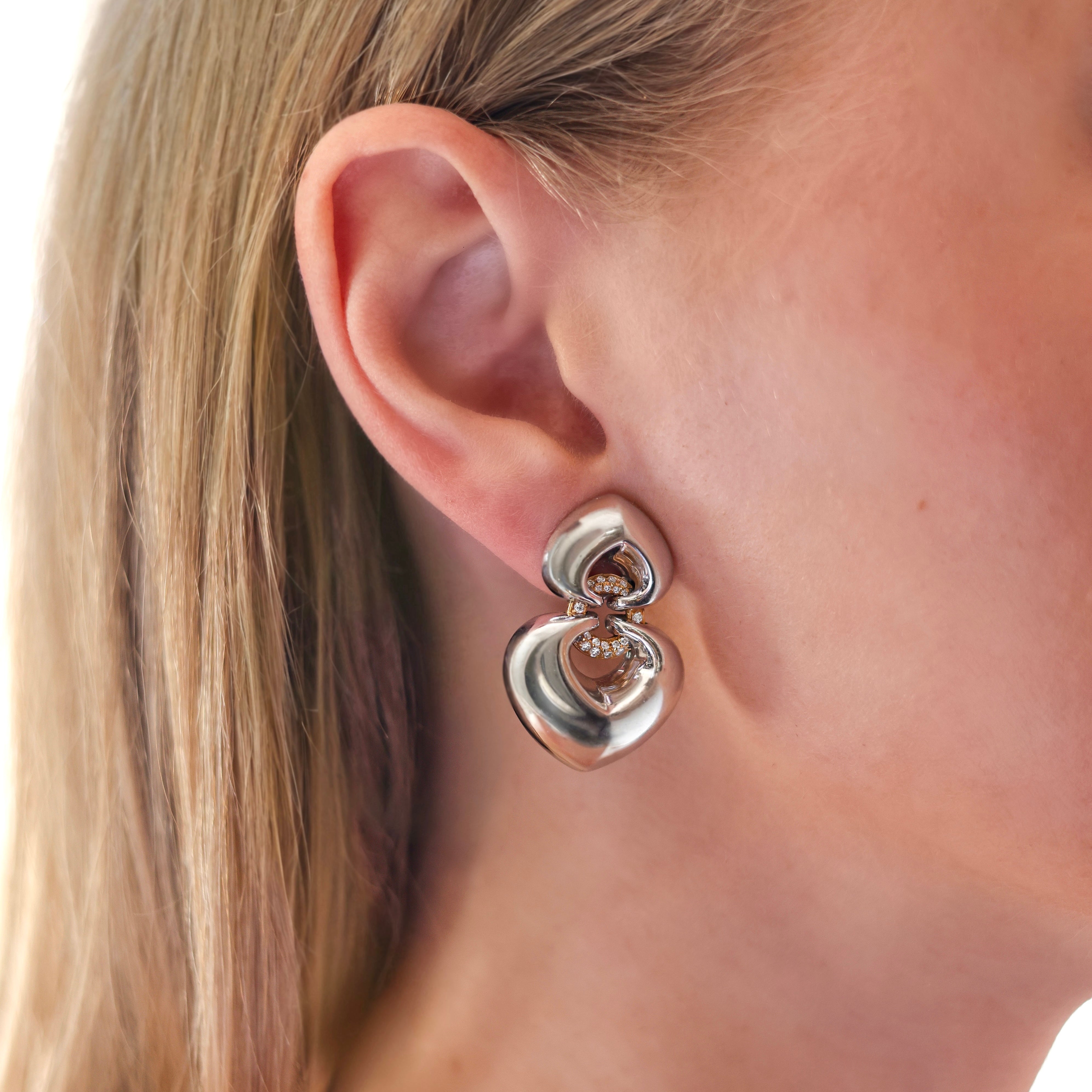 Vintage Bvlgari Doppio Cuore diamond earrings in 18K white and yellow gold on model