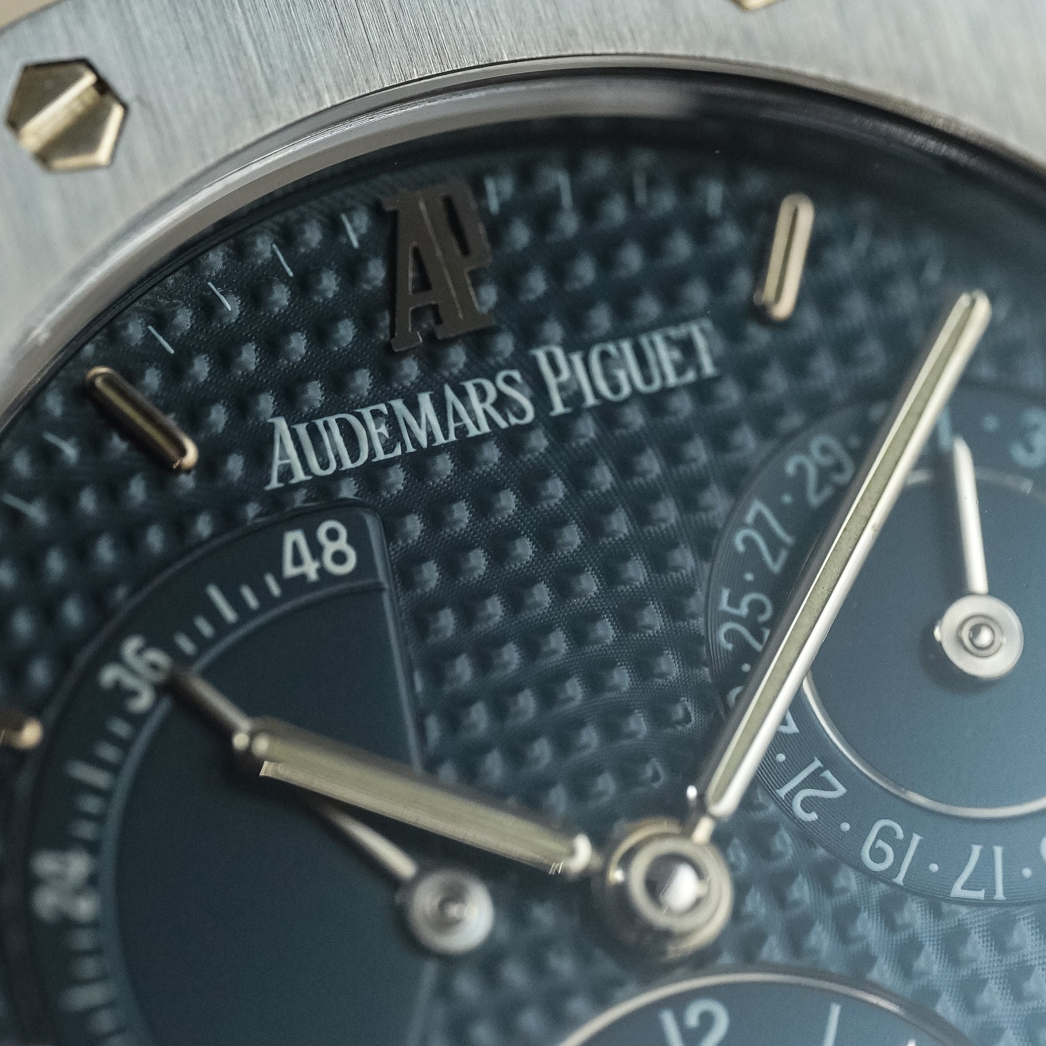 Close-up of an Audemars Piguet watch face with detailed design.