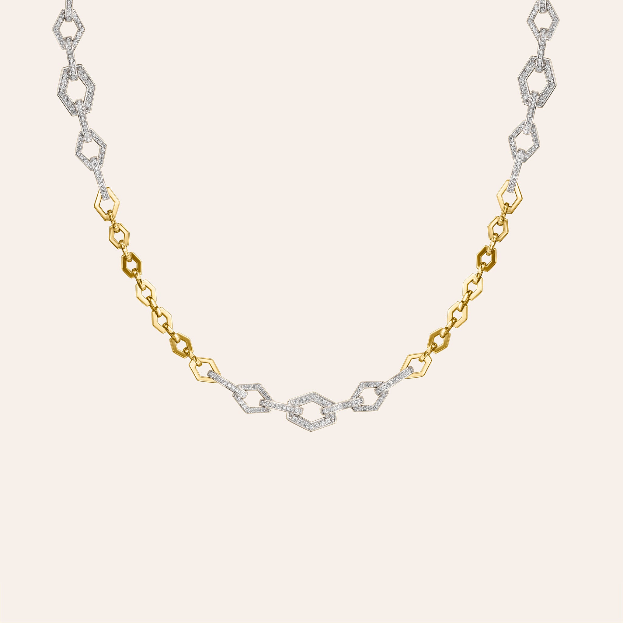 Detail of Cadence necklace showing alternating polished gold and pavé diamond hexagon links
