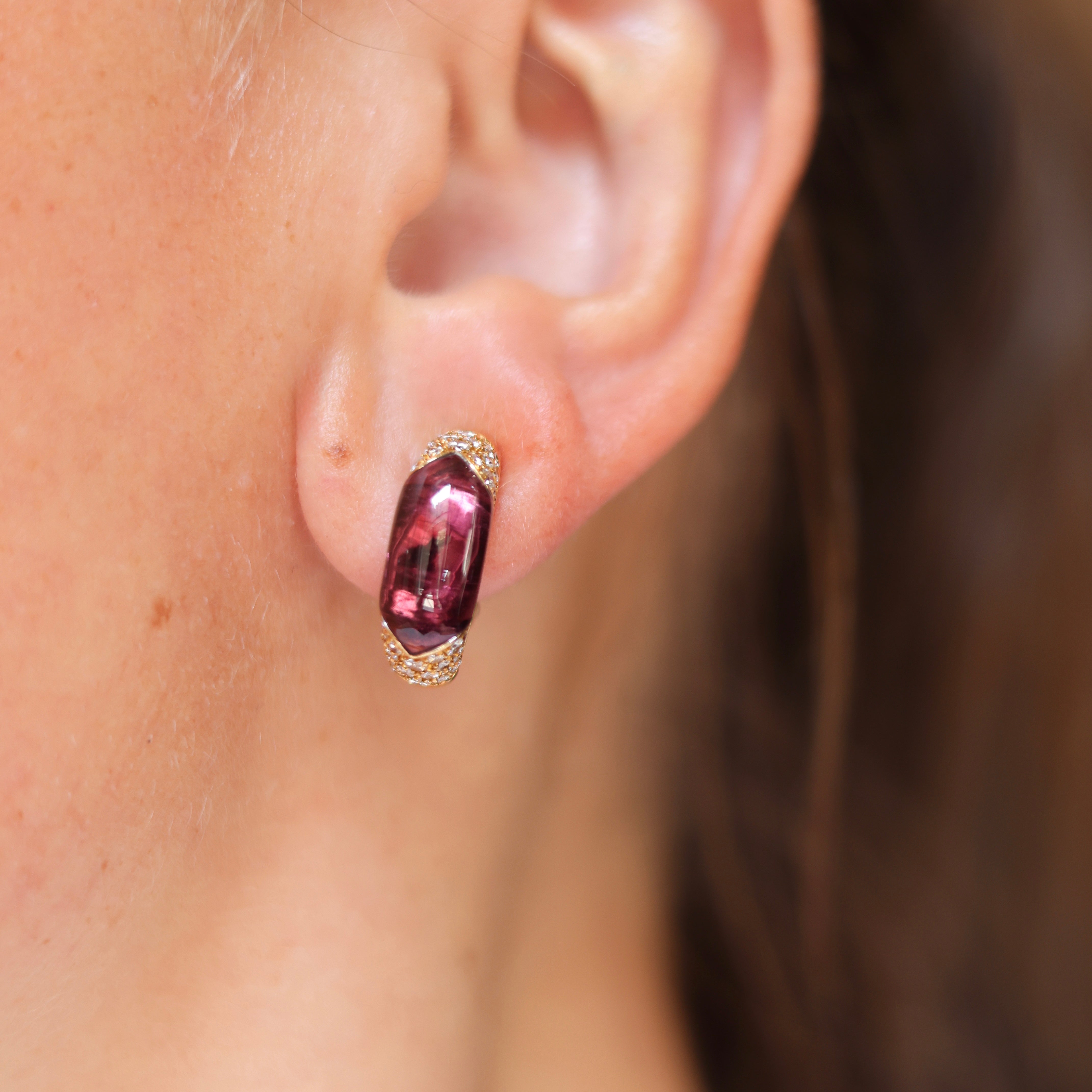 Vintage Bvlgari 18K yellow gold hoop earrings with pink tourmaline and pavé diamonds on models ear