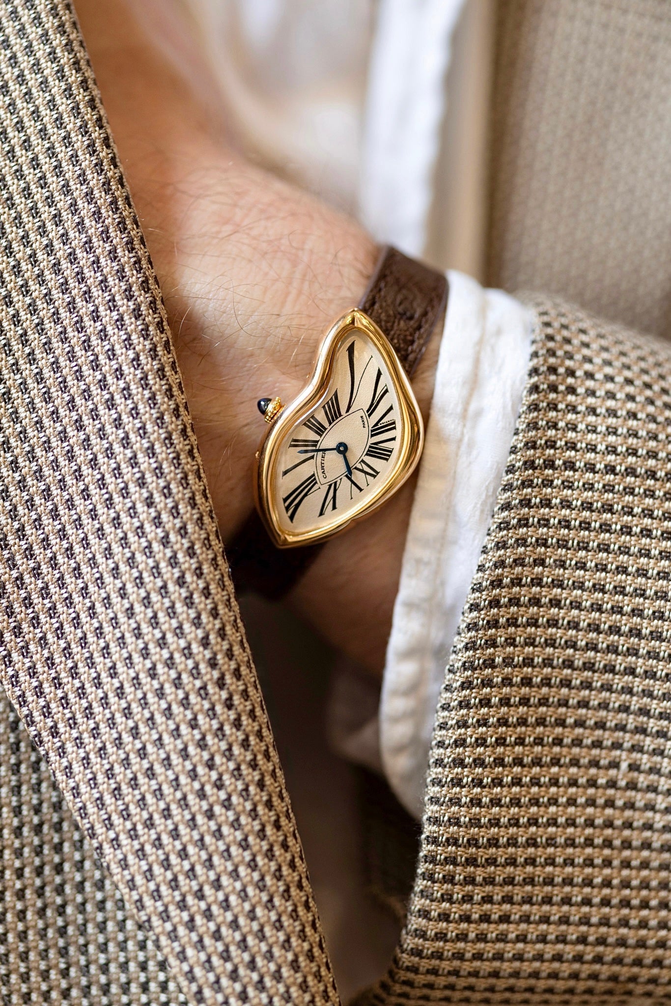 wristwatch with a unique design on a man's wrist