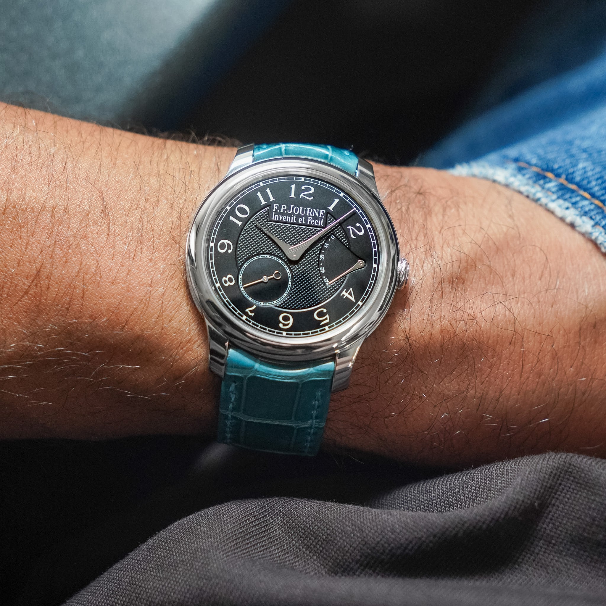 A close-up of a wrist wearing a F.P.Journe watch
