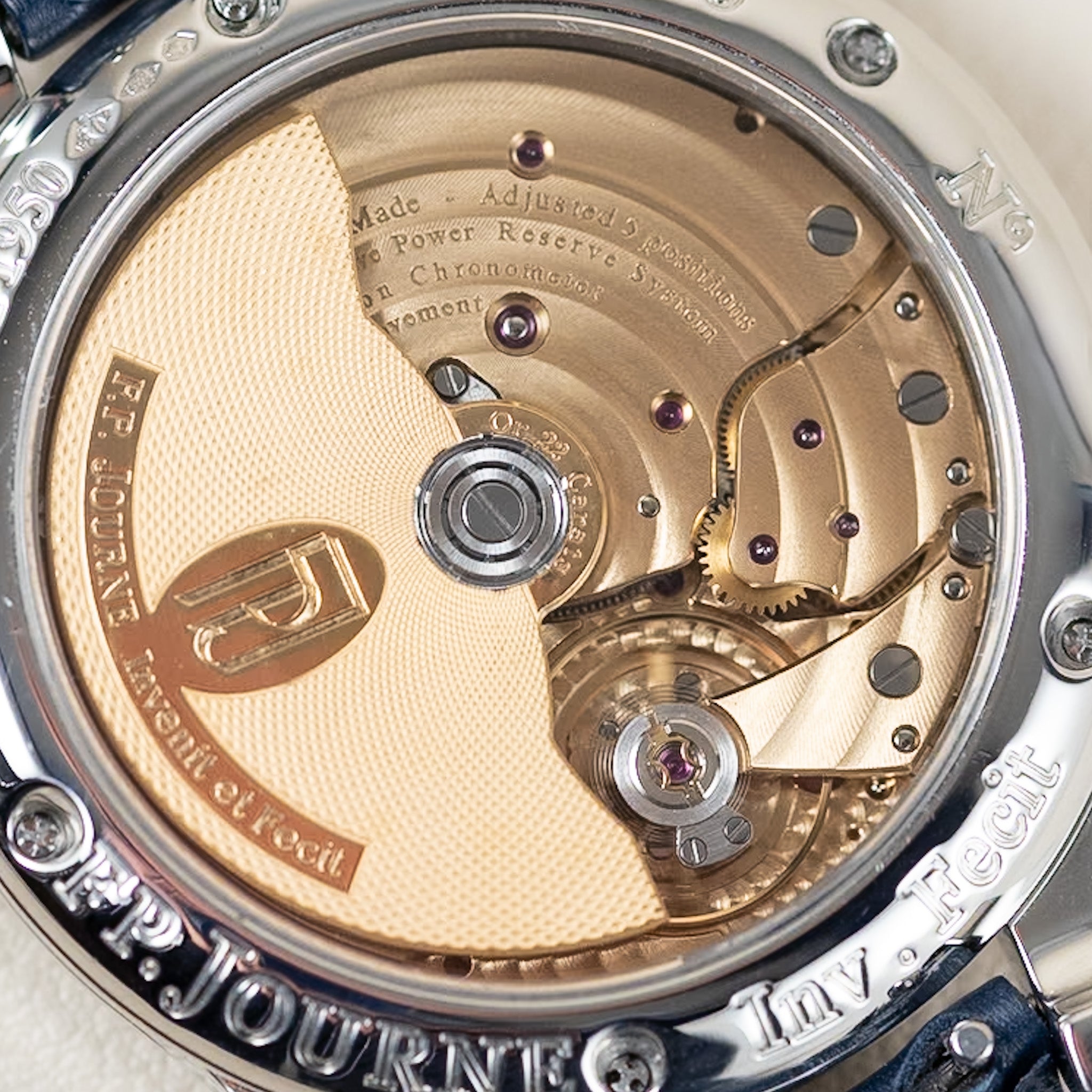 Close-up of a watch mechanism with 'P. P. Journe' branding.