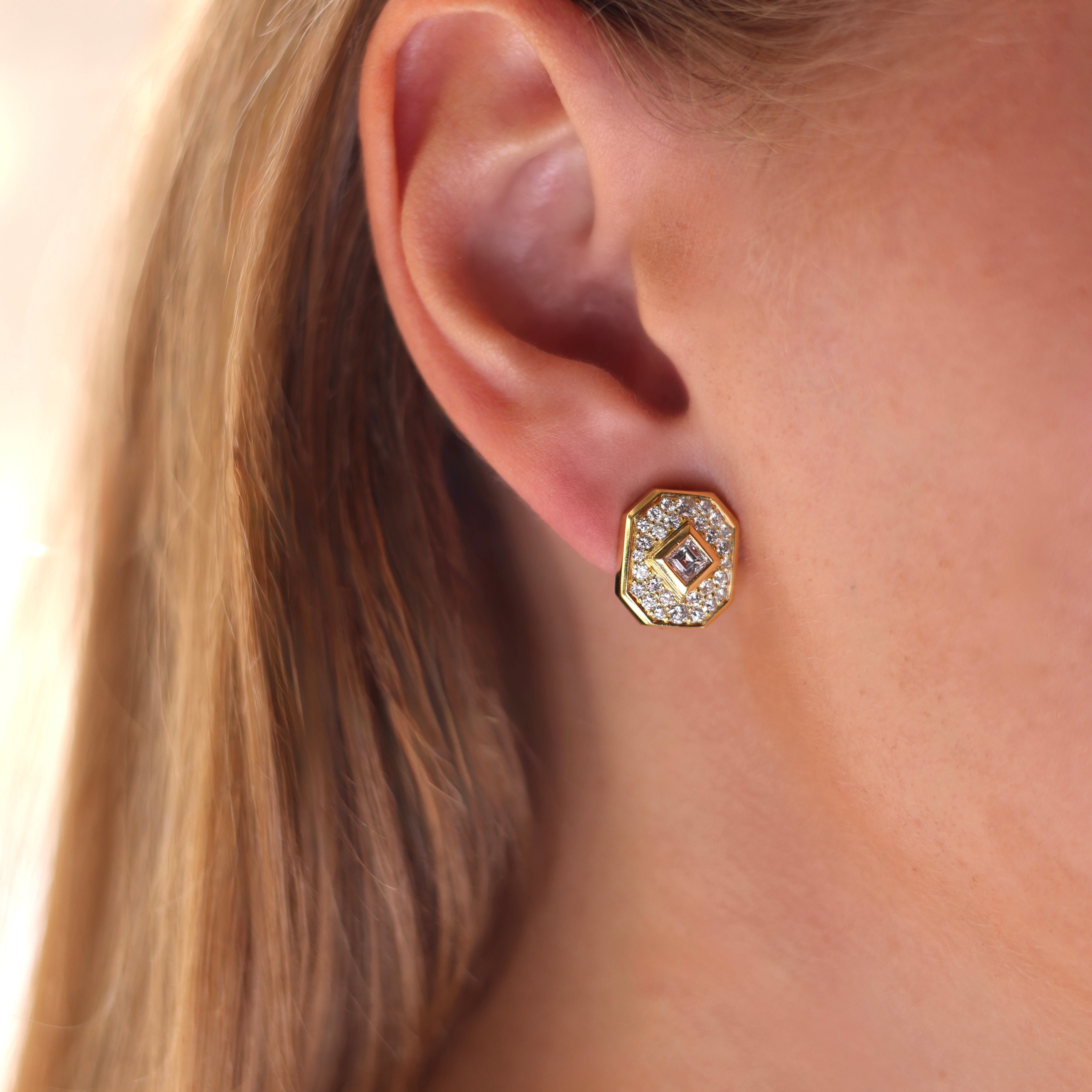 Vintage Bvlgari 18K yellow gold earrings with a square step-cut diamond and pavé diamond surround on model 