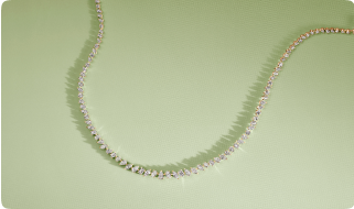 diamond necklace over mint green background