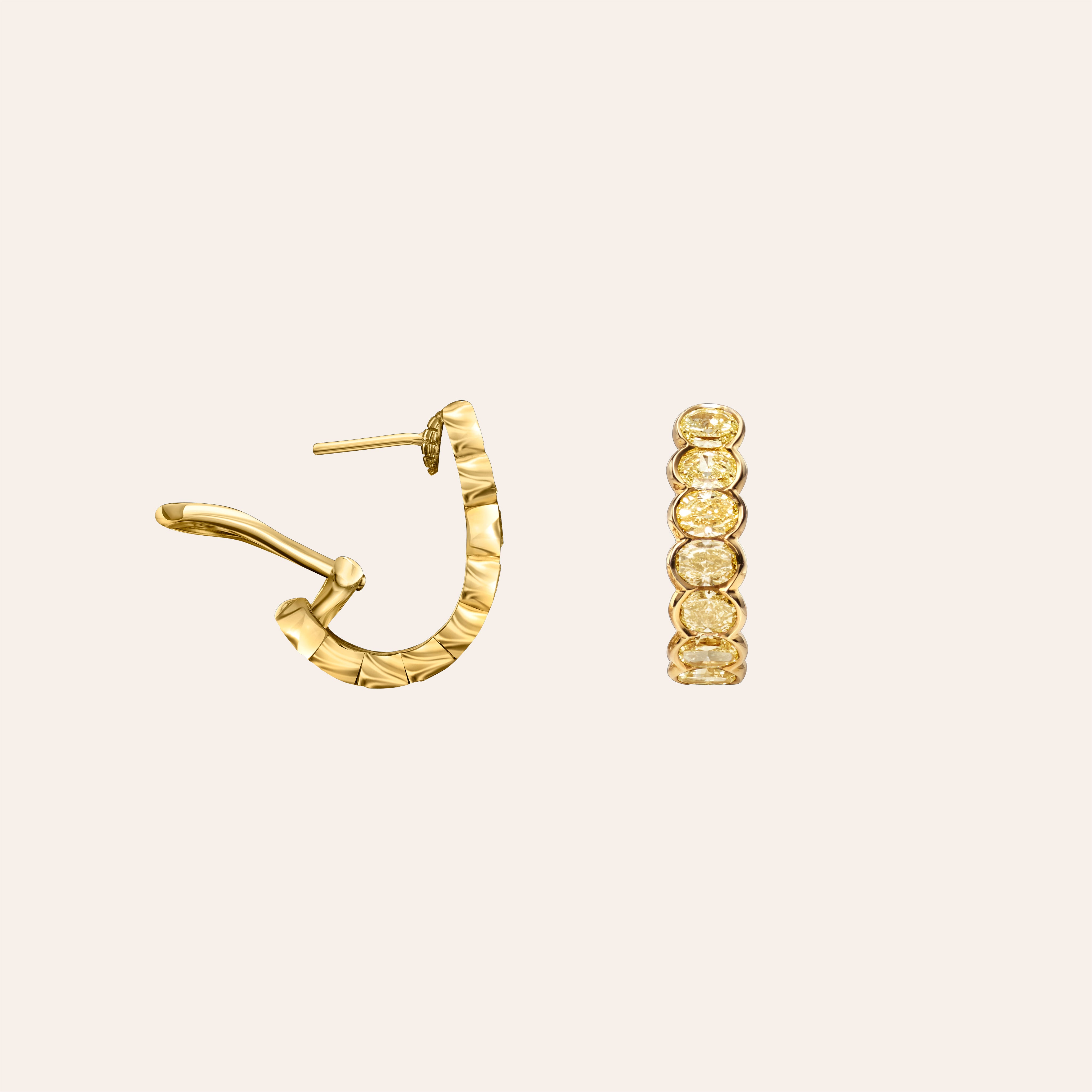 Fancy yellow bezel set oval diamond semi hoop earrings in 18K yellow gold