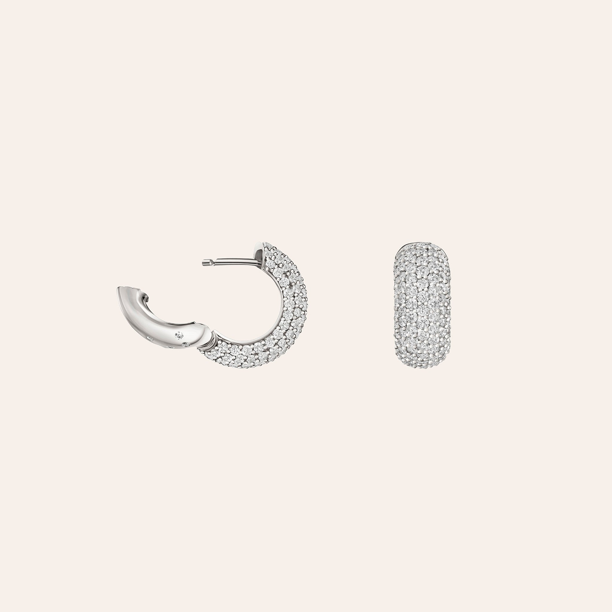 Side view of an 18K white gold diamond pavé huggie earring showing the domed silhouette