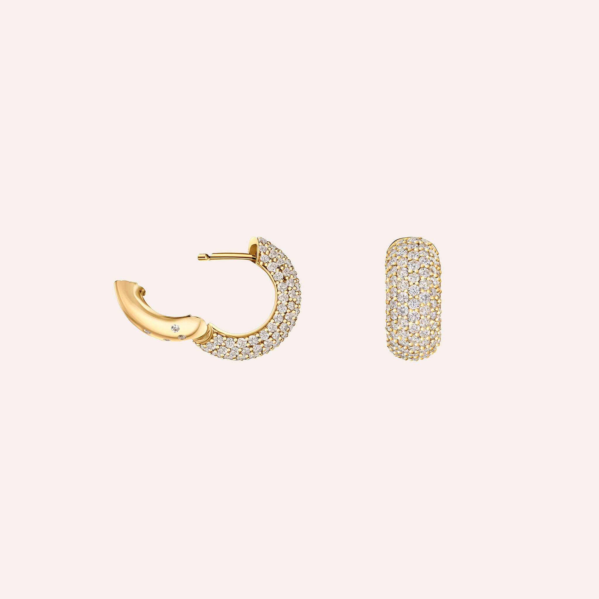 Side view of an 18K yellow gold diamond pavé huggie earring showing the domed silhouette