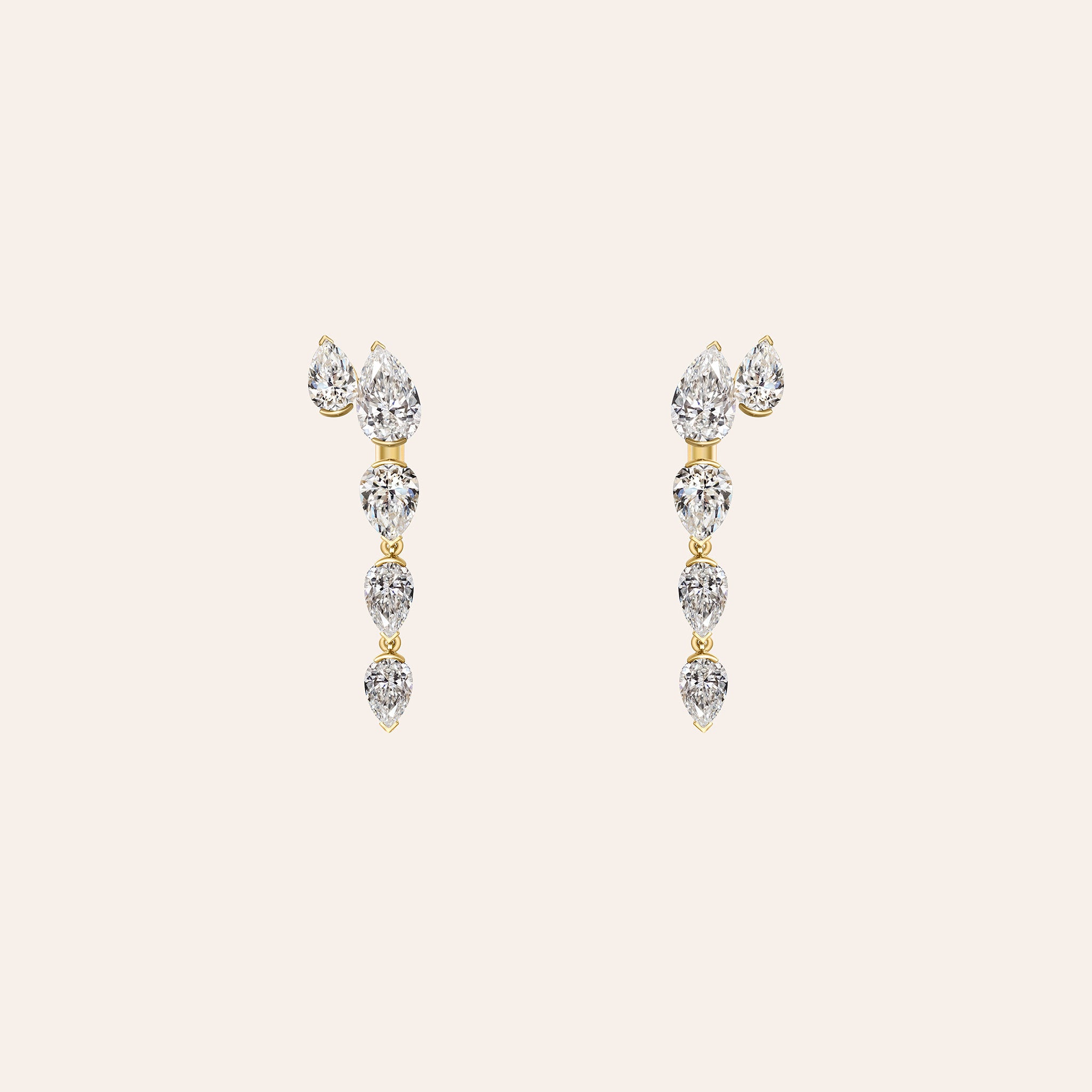 A pair of gold drop earrings with a series of  pear-cut diamonds, displayed on a light beige background.