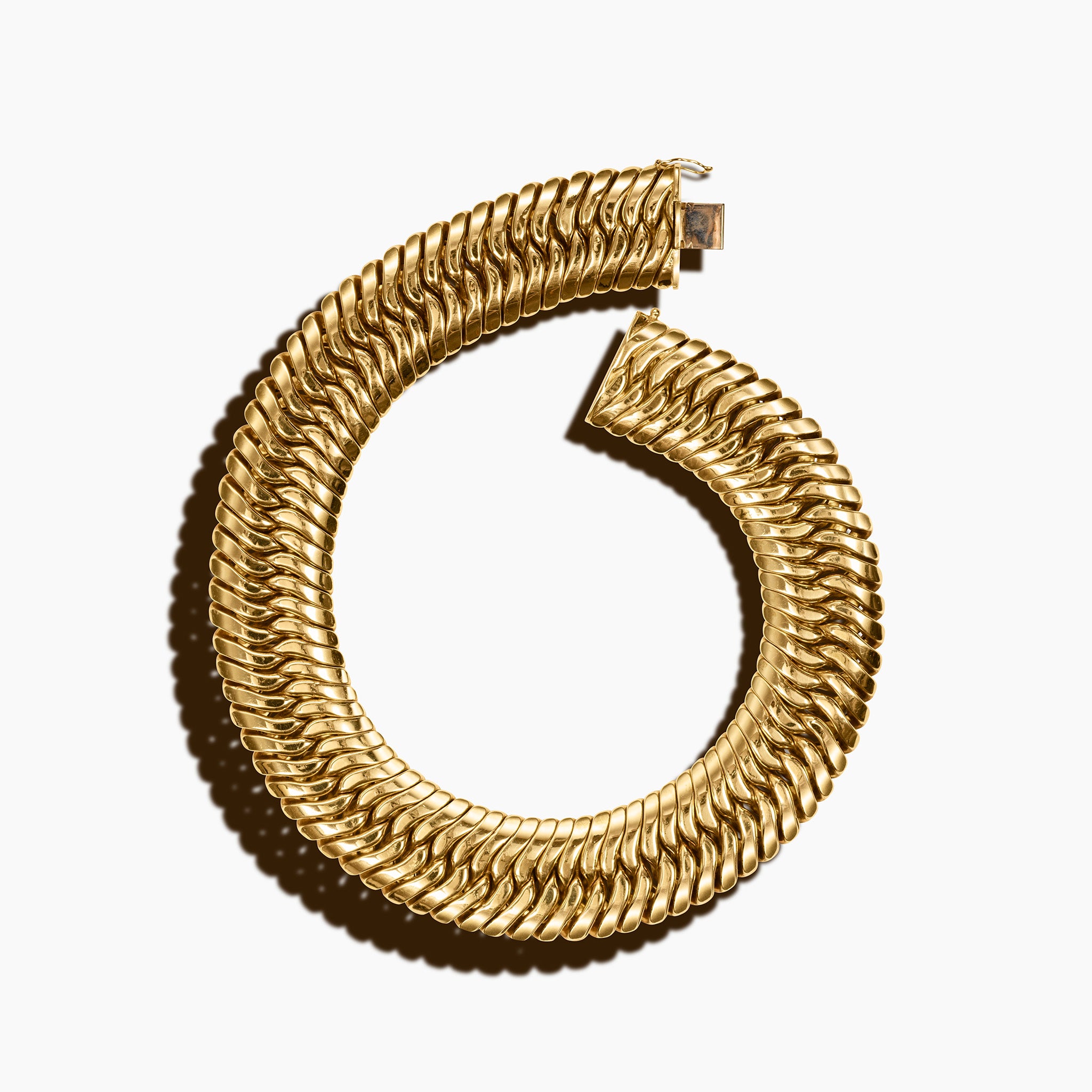 Vintage 18kt yellow gold wide woven herringbone collar necklace, 30mm width, 17 inches, with box clasp, photographed on a cream background.
