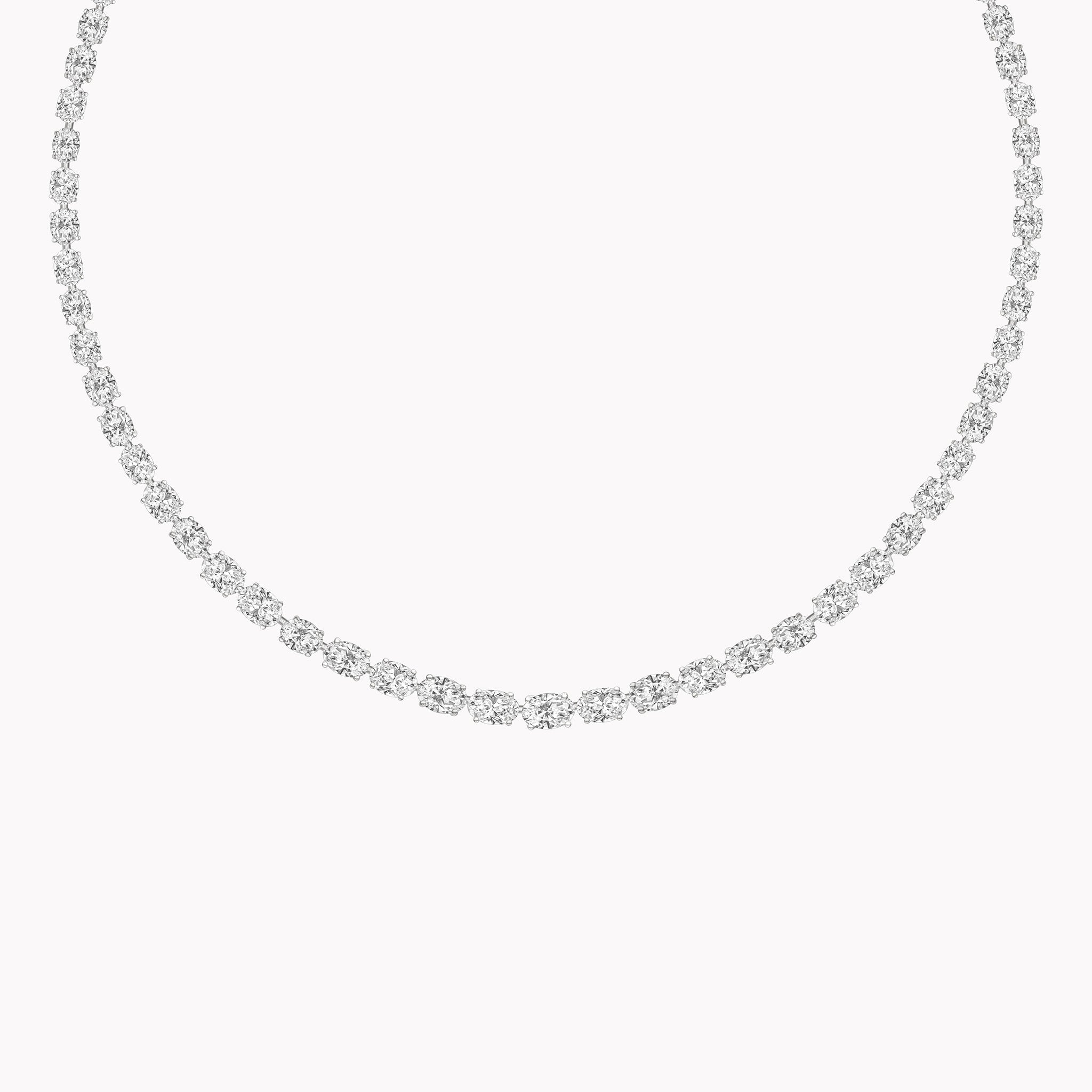 18K gold East-West oval diamond tennis necklace featuring 23.02ct of GIA-certified D–G SI1–VS2 diamonds in a continuous, modern line design.