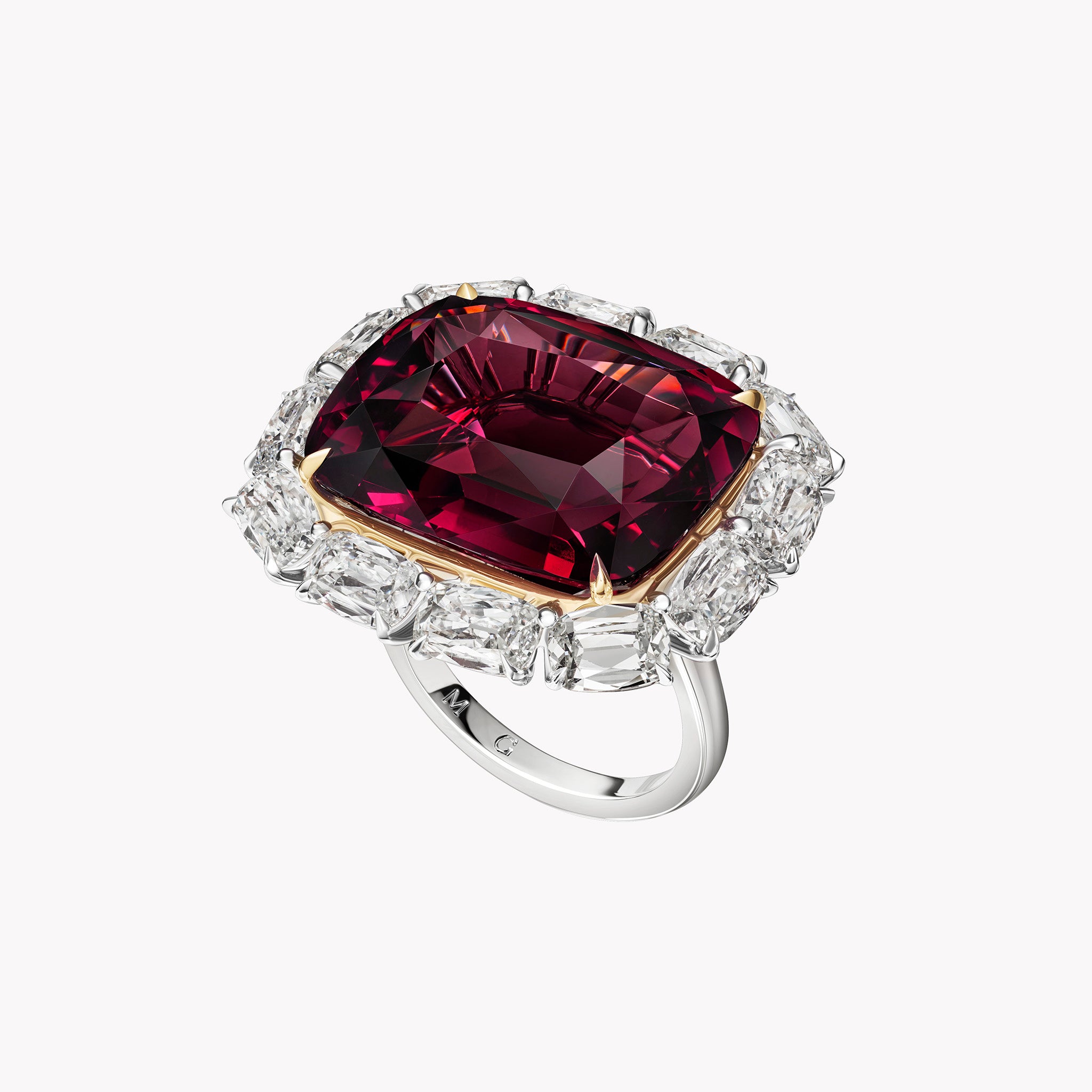 Cushion Garnet & Diamond Cocktail Ring in 18K yellow gold and platinum featuring a 34.46 carat cushion-cut garnet and 6.24 carats of antique cushion-cut diamonds.