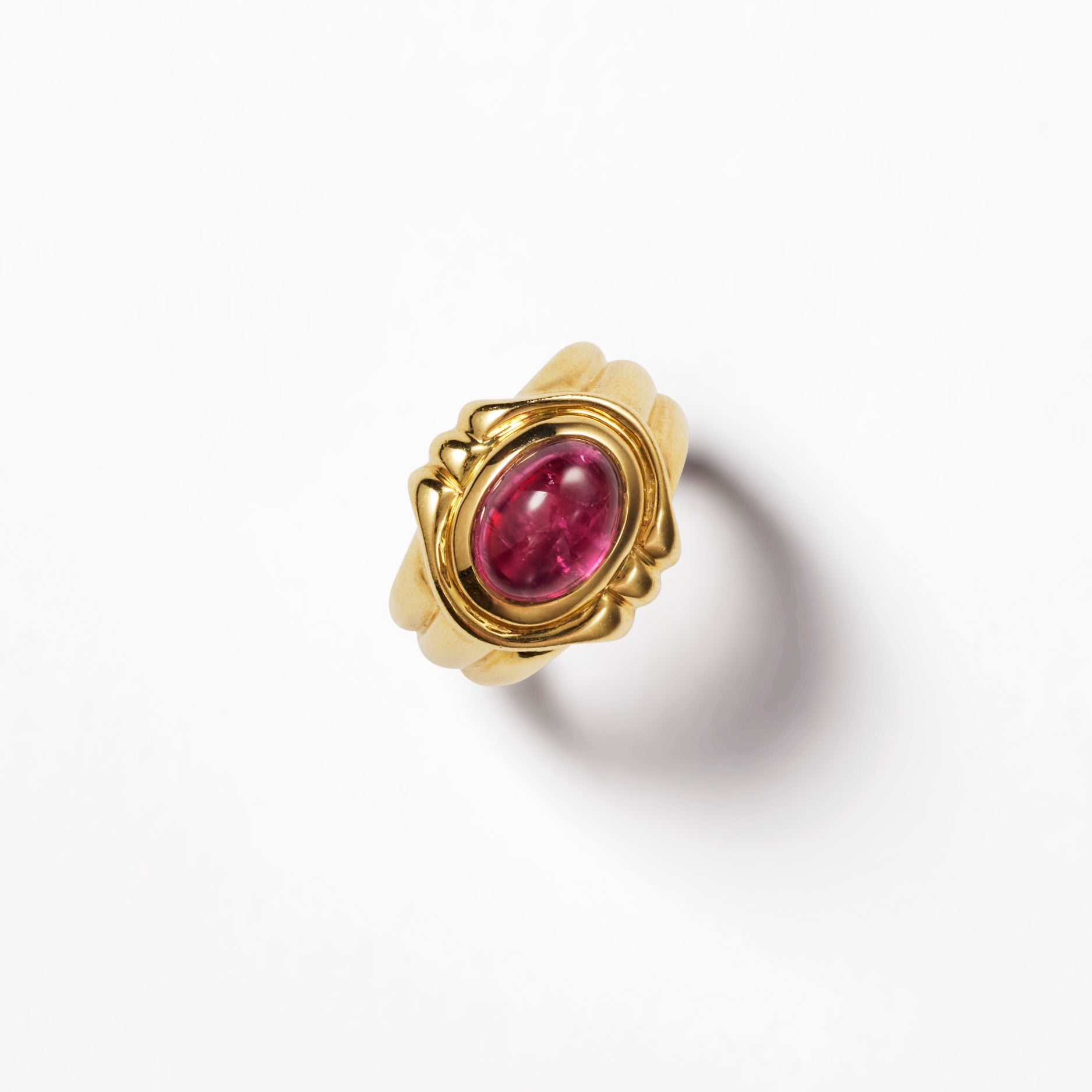 Signed vintage Bulgari 18K yellow gold ring with oval pink tourmaline cabochon in sculptural scalloped setting