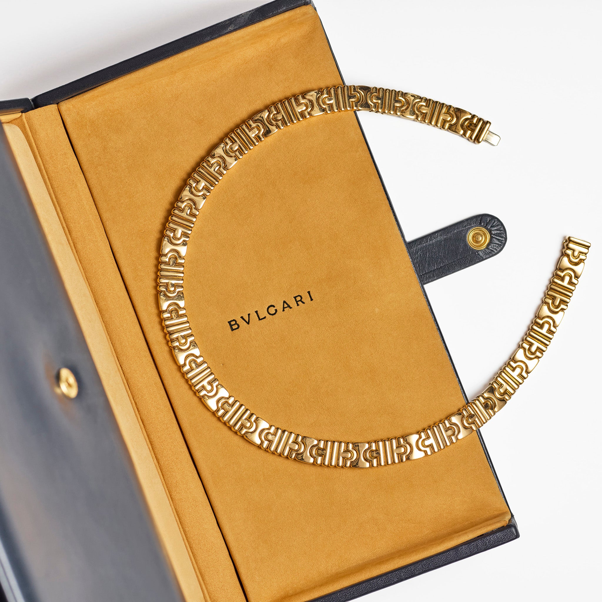 Signed vintage Bulgari Parentesi 18K yellow gold collar necklace with interlocking architectural bracket links
