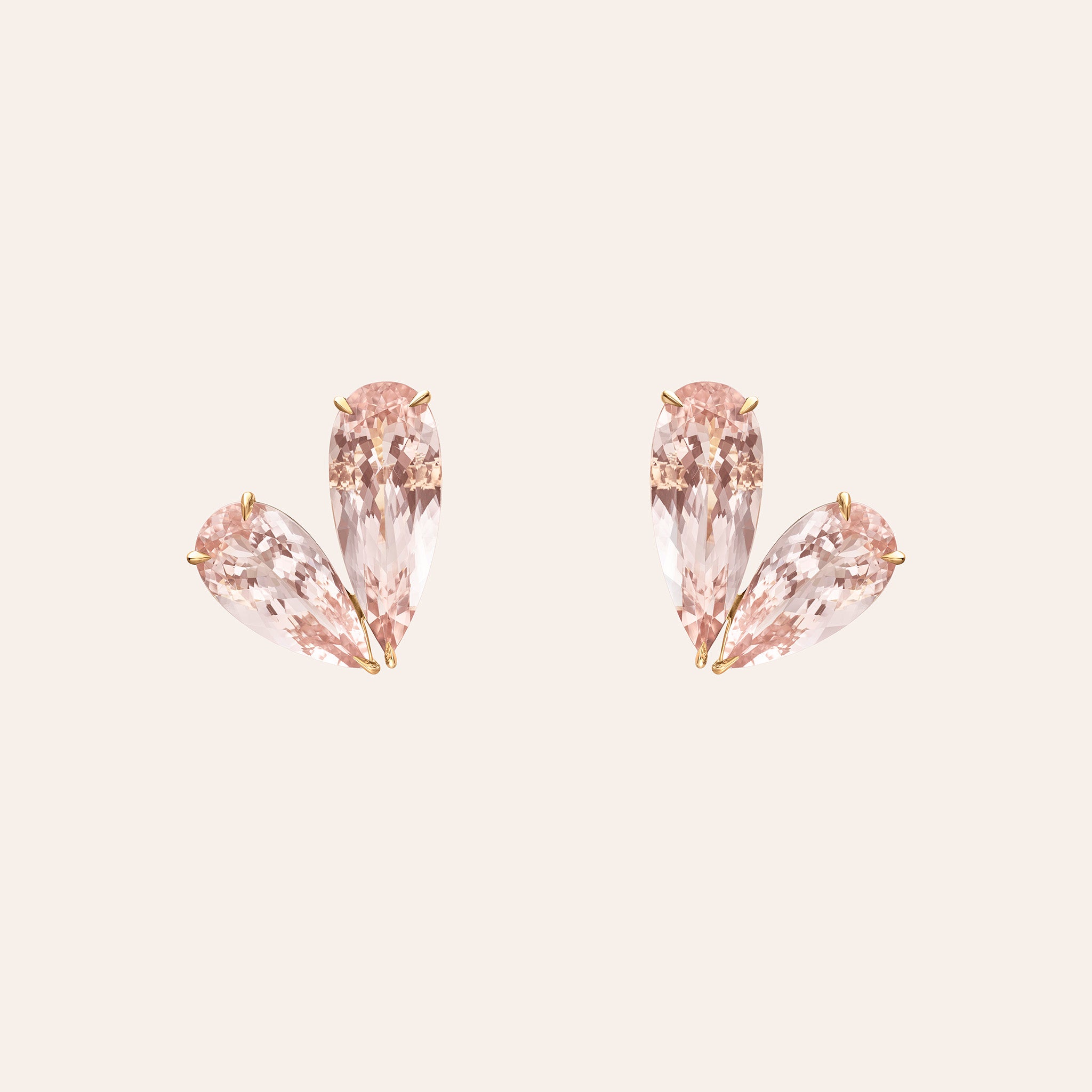 18K gold heart-shaped stud earrings featuring blush pink pear-shaped morganite gemstones.