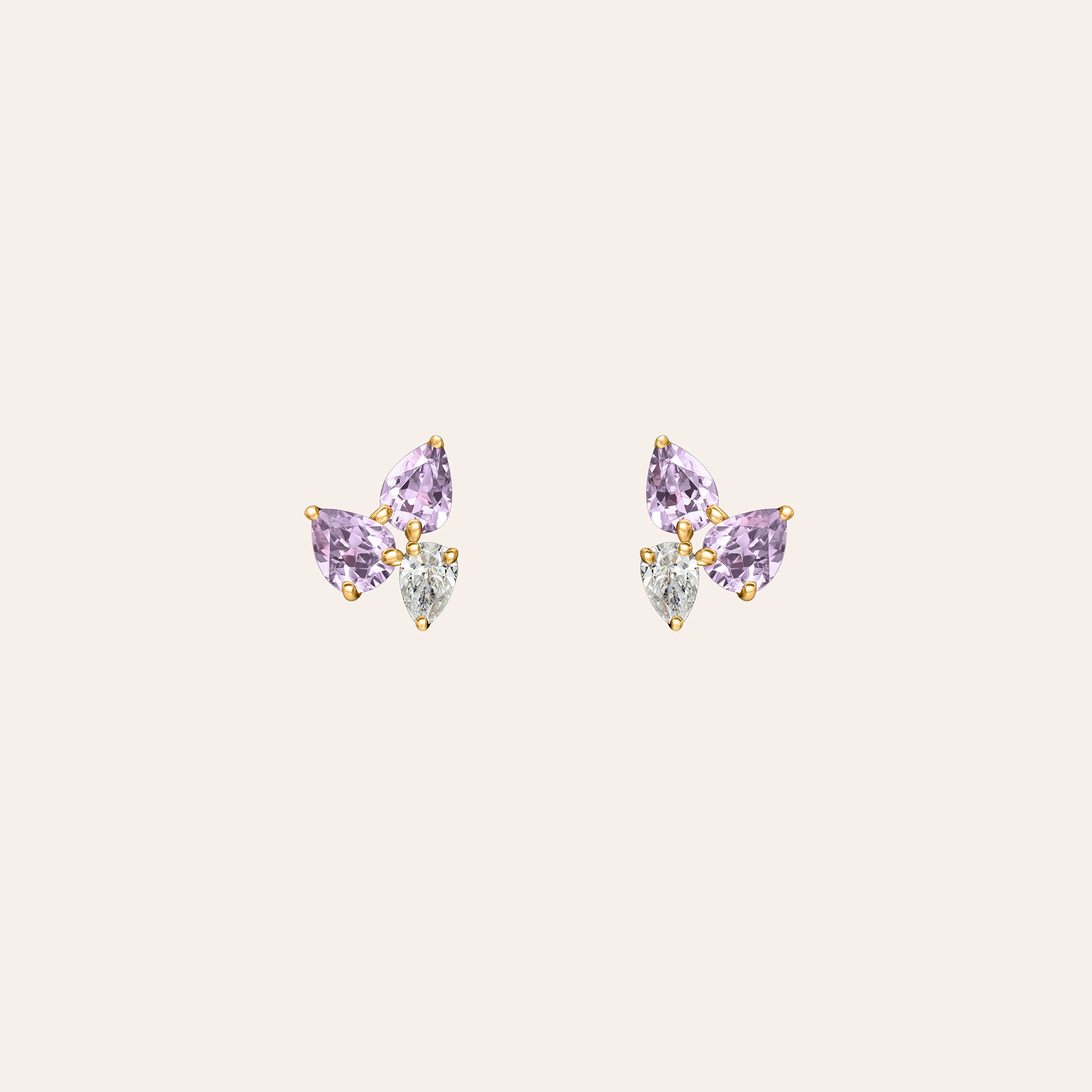 Yellow gold stud earrings featuring a trio of pear-shaped amethysts and a pear-shaped diamond arranged in a cluster, set with gold prongs.