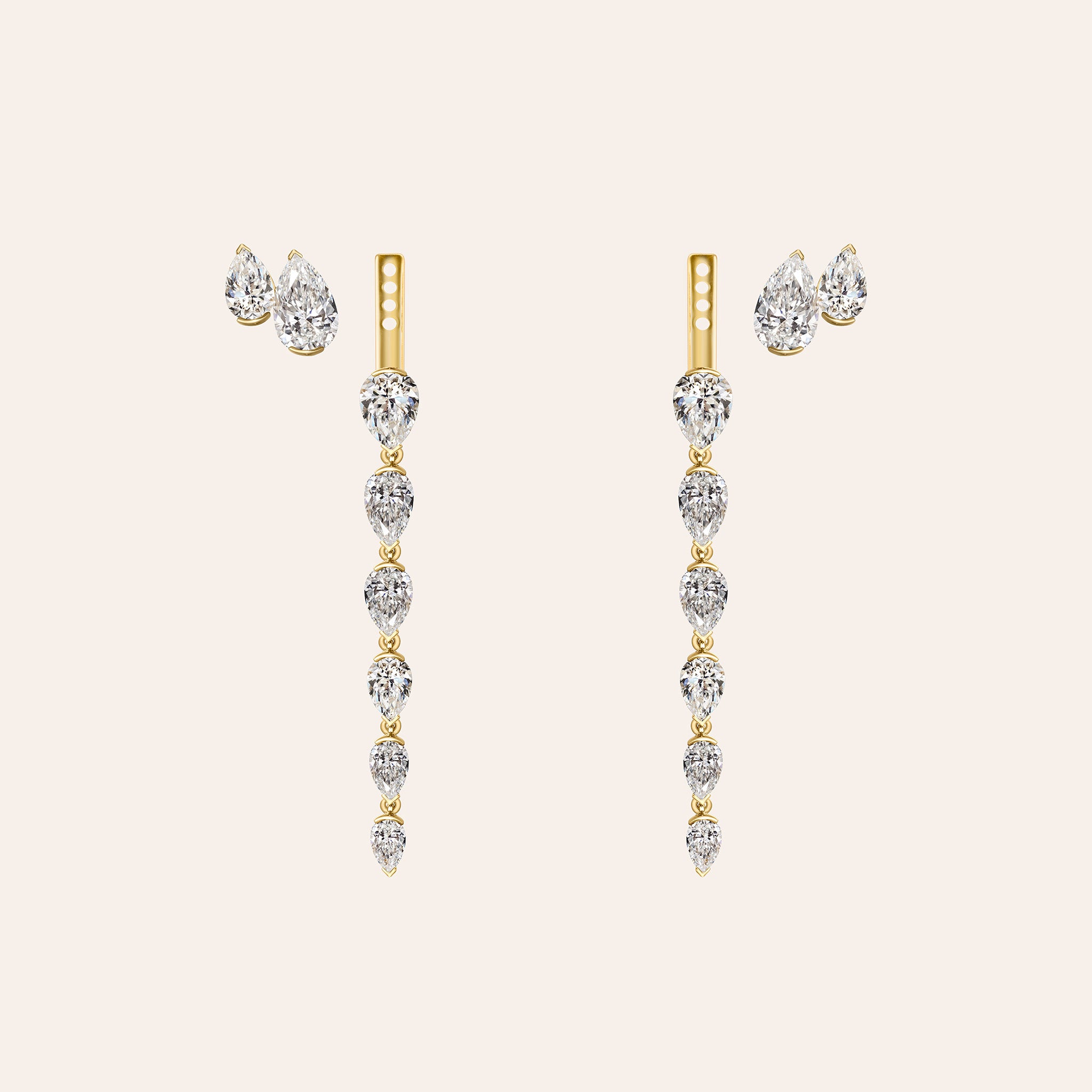 The Aryna Earring Jackets shown two ways: the pear diamond stud alone and attached to the graduated drop jacket in 18K yellow gold