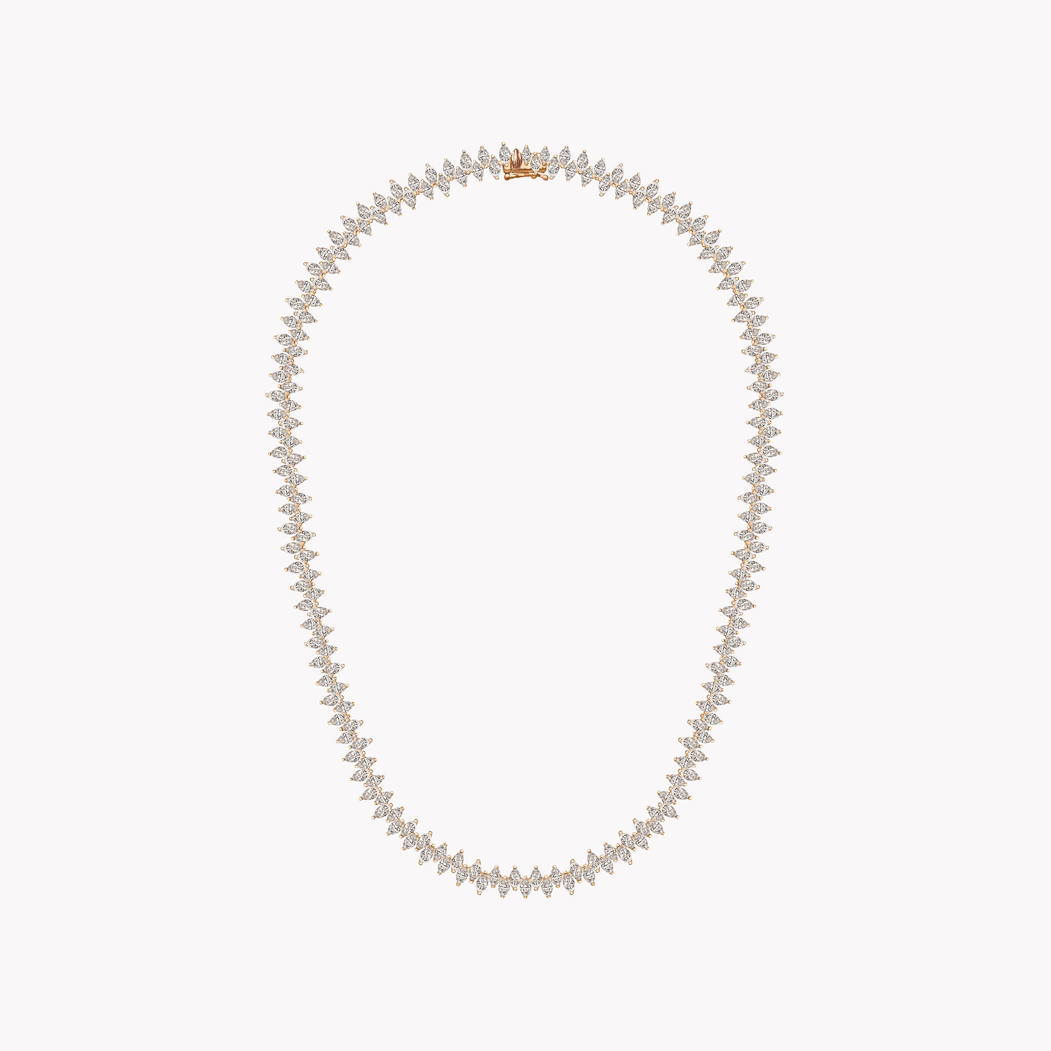 Marquise Diamond Rose gold necklace on a light coral background