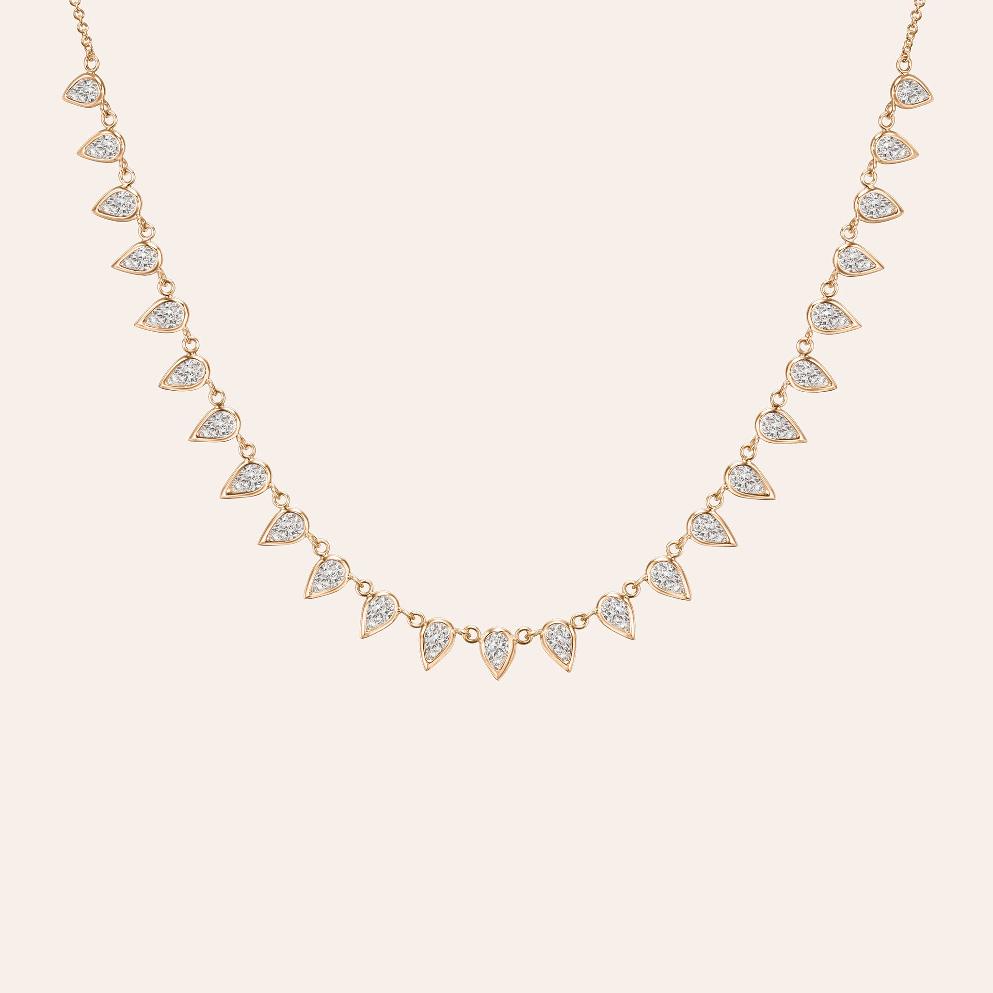 18K yellow, white and rose gold necklace featuring approximately 3.75 ct of G/H color, VS-SI clarity pear-shaped diamonds in a fringe design.