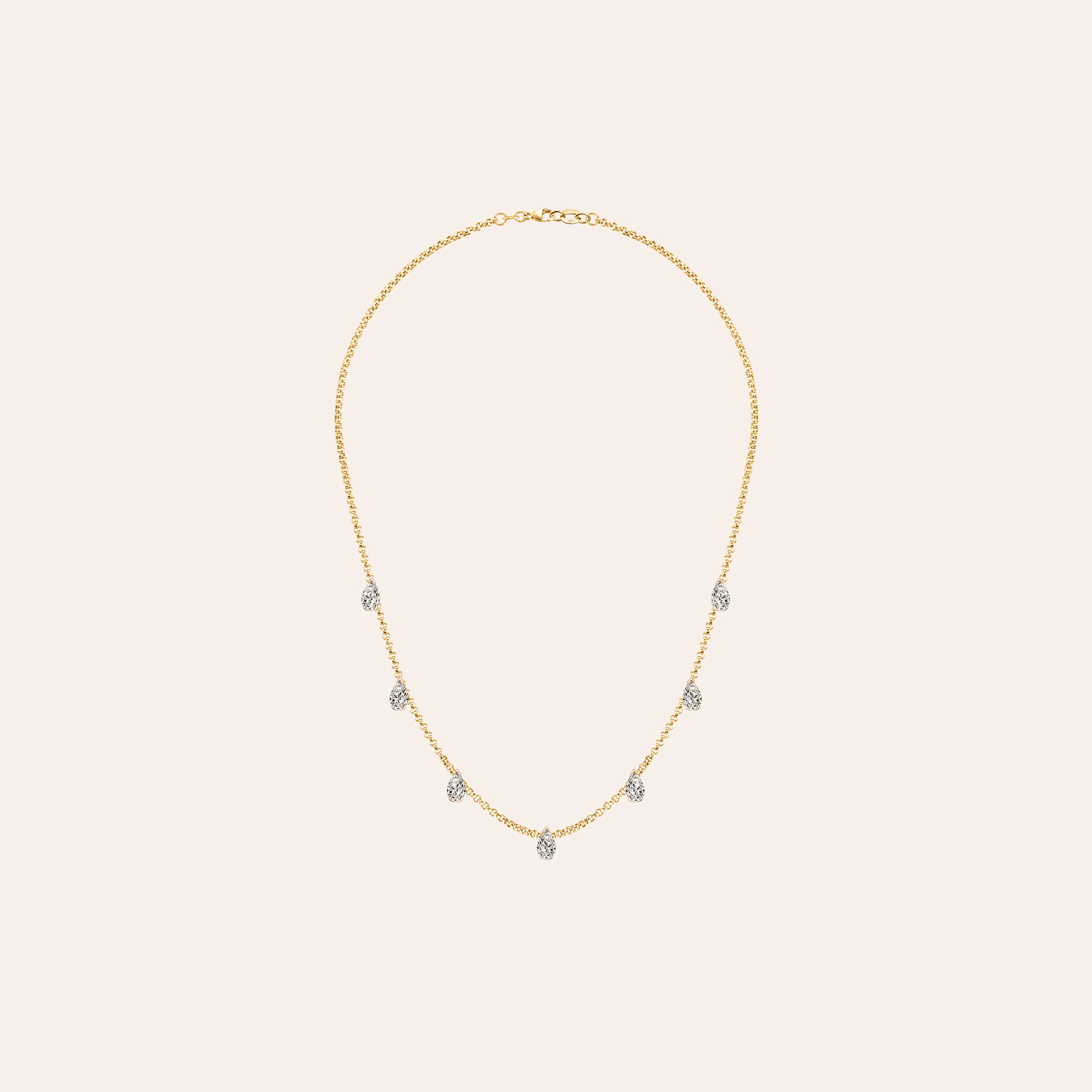 Customizable pear diamond choker necklace in 18K yellow gold featuring seven bezel-set diamonds on a delicate chain. 