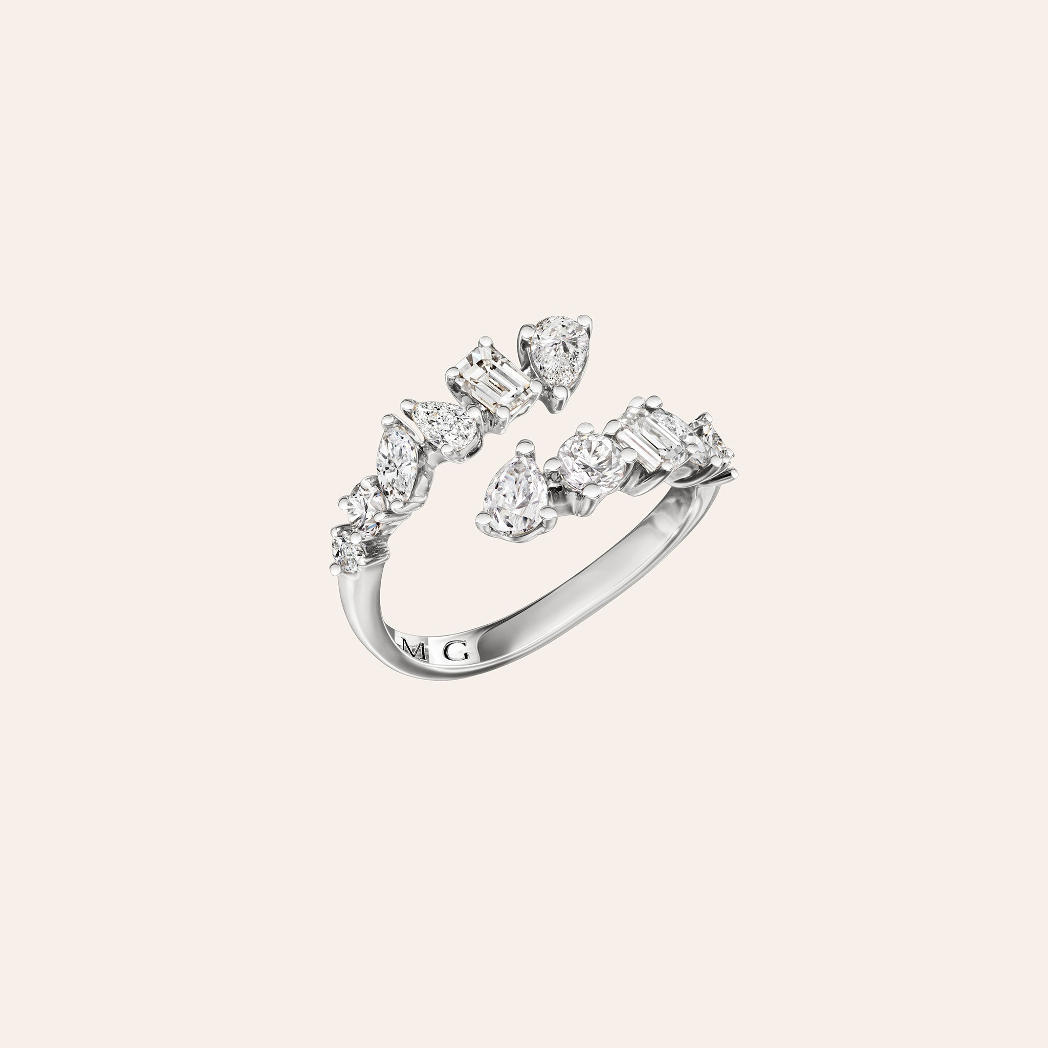 White Gold multishape diamond ring on a cream background side angle