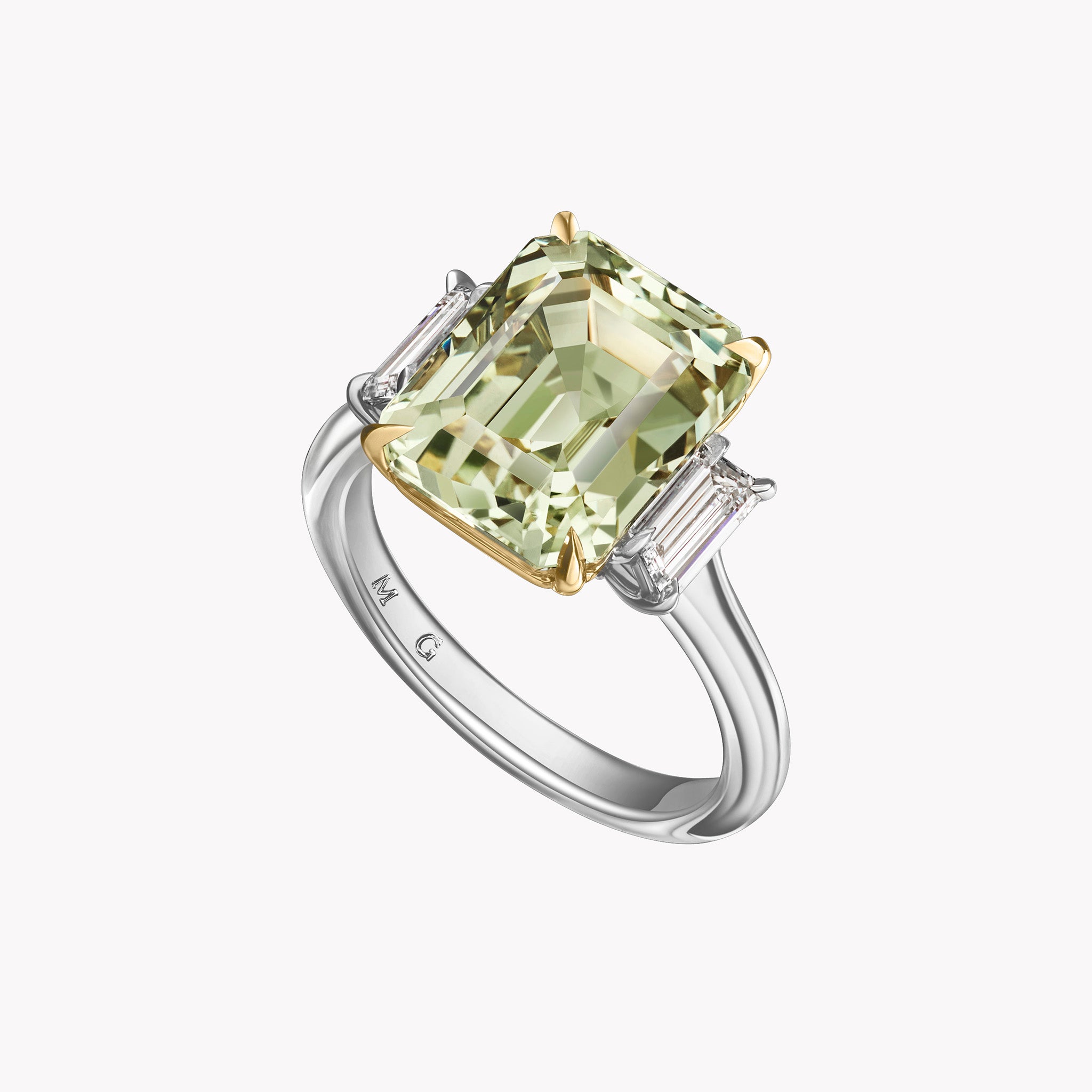 Aster three-stone ring with a 9.10ct emerald-cut green sapphire and trapezoid diamond sides set in platinum with 18K yellow gold prongs.