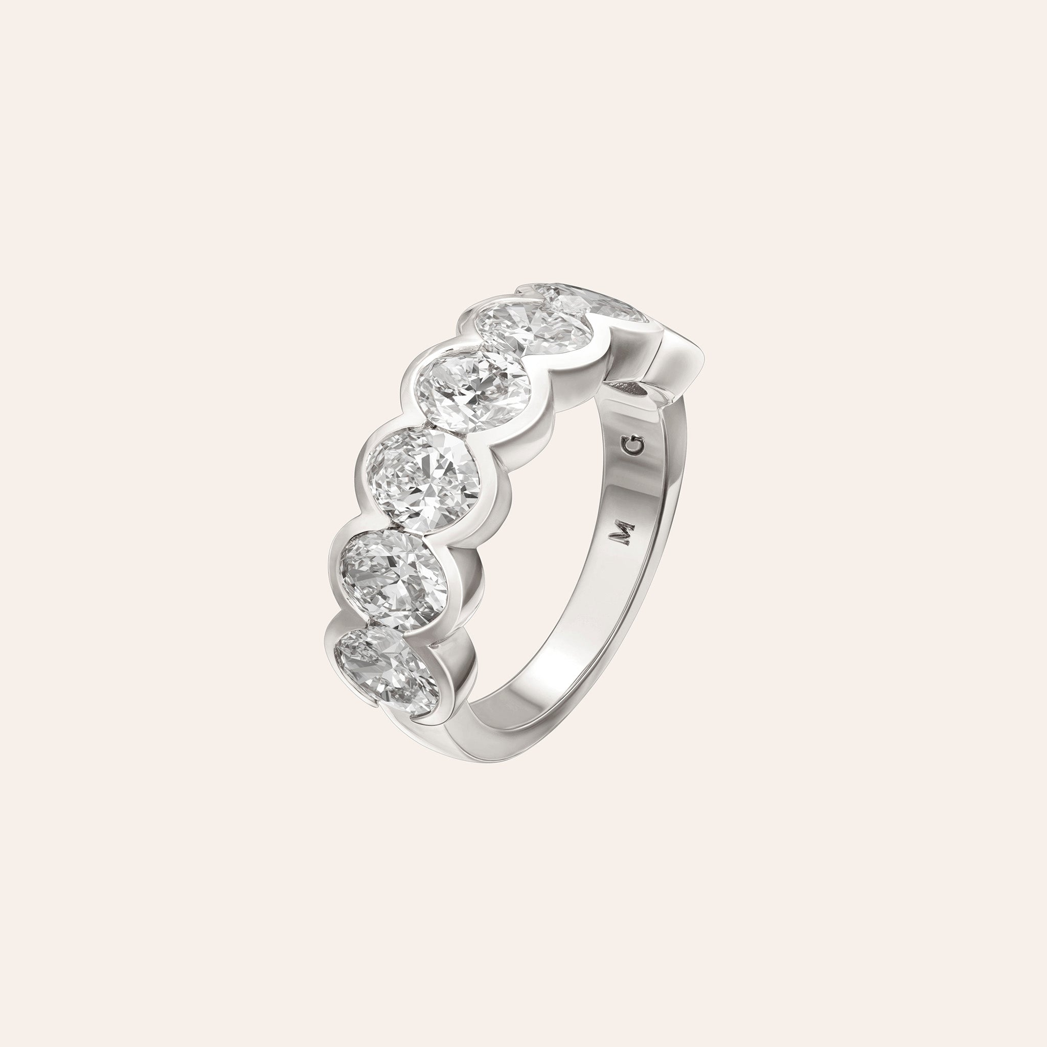 Large Alexa Oval Half Band in 18K white gold with 3.60 carats of bezel-set oval diamonds