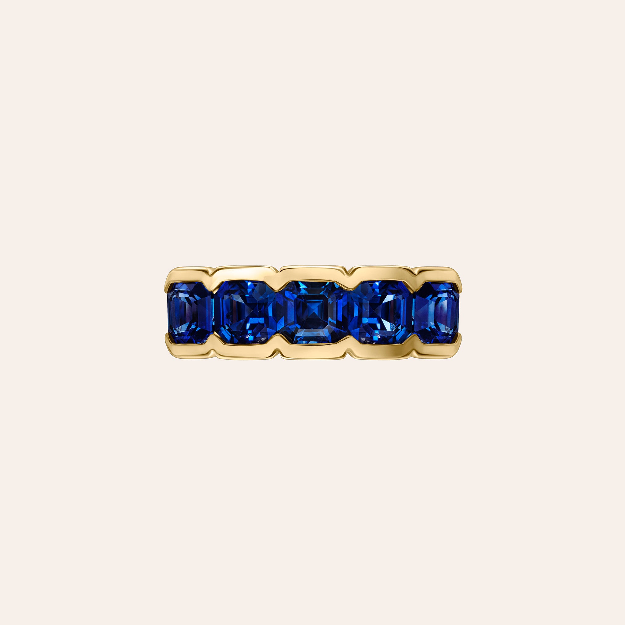The Blue Sapphire Alexa Pinky Ring by Material Good, featuring five Asscher-cut blue sapphires in a sleek half-bezel setting, handcrafted in 18K rose gold.