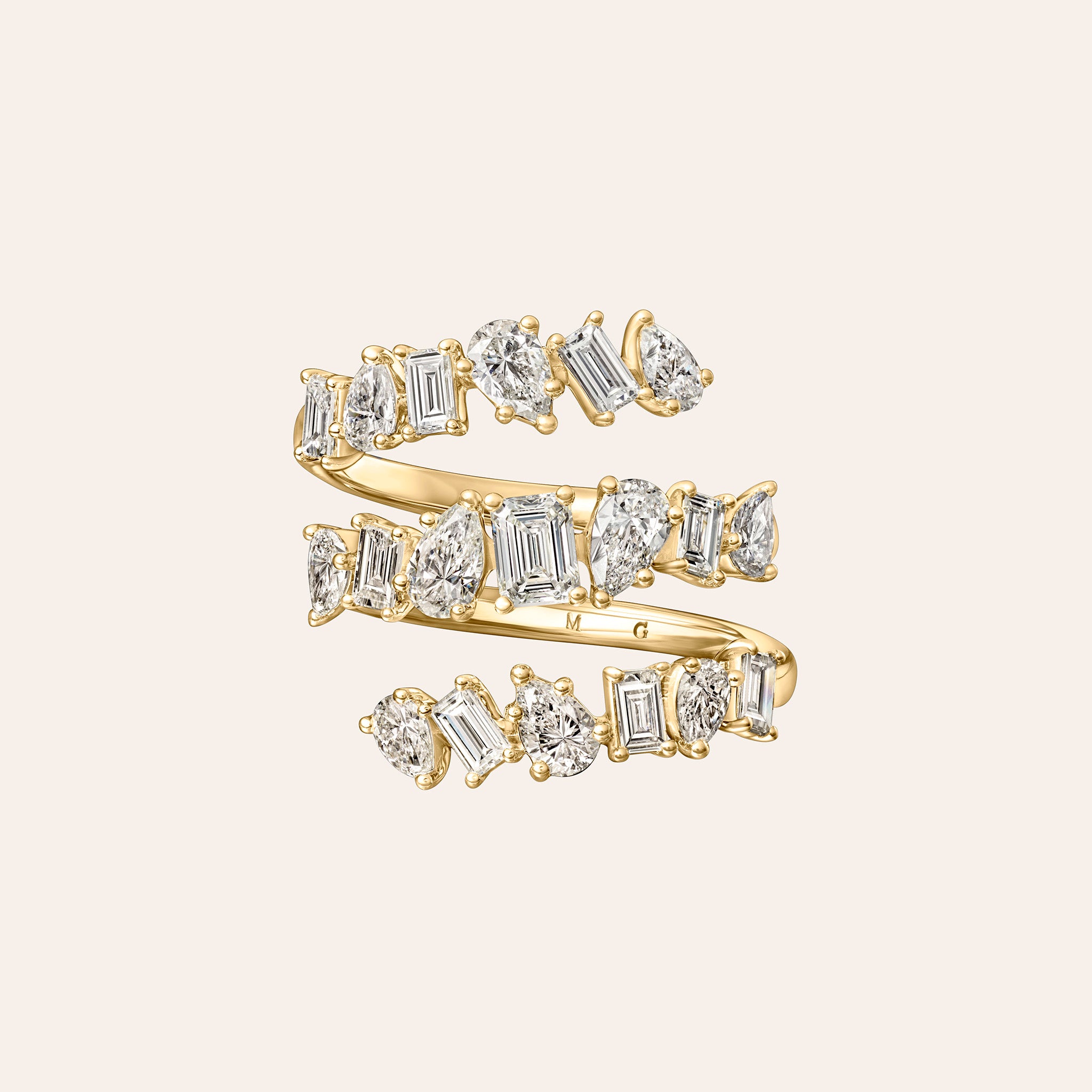 Emerald & Pear Shape Diamond Spiral Ring in 18K yellow gold featuring 2.30 carats of G/H color, VS-SI clarity diamonds.