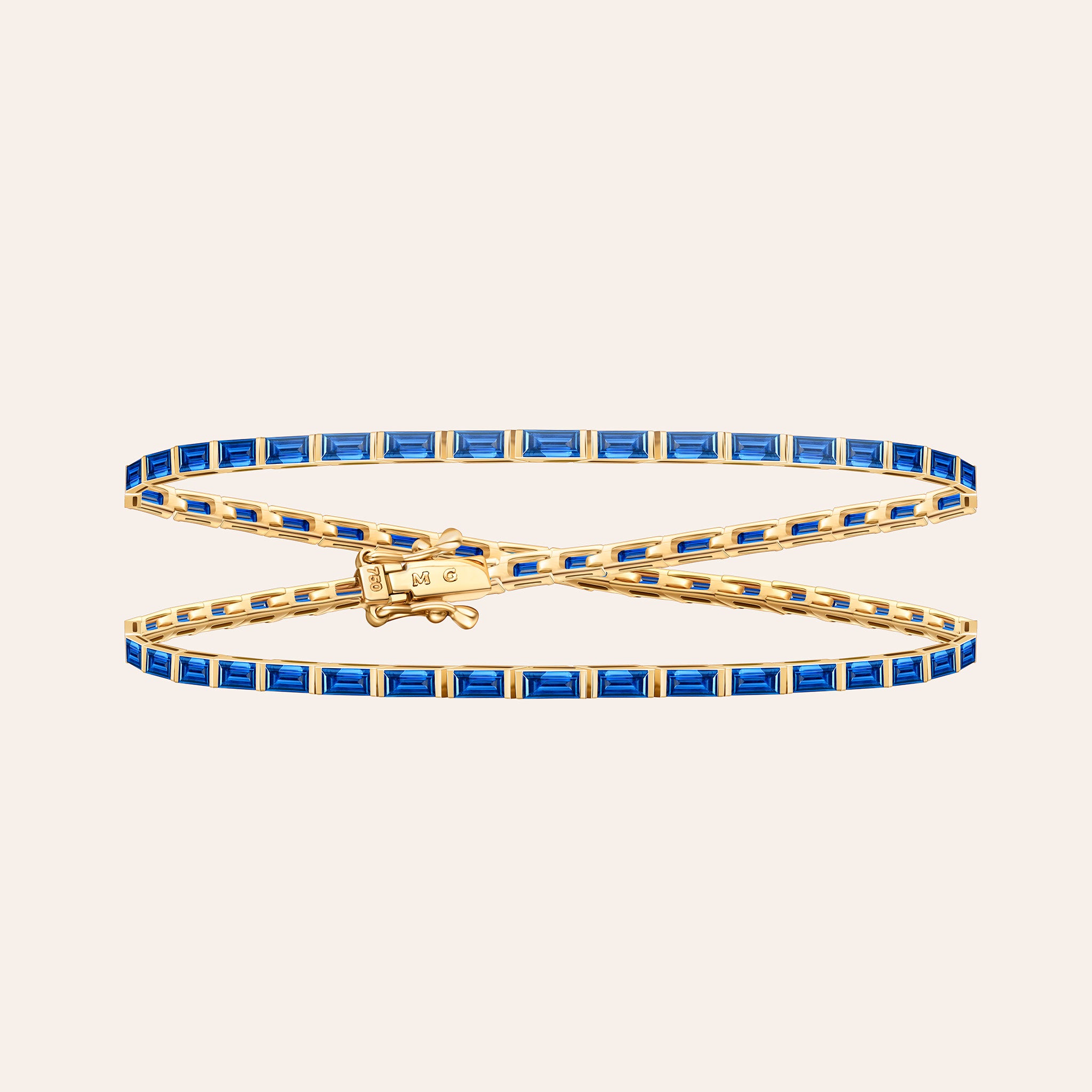 The Maia Sapphire Wrap in 18k rose and yellow gold, a long wrap bracelet set with 5.60 ct of baguette rubies
