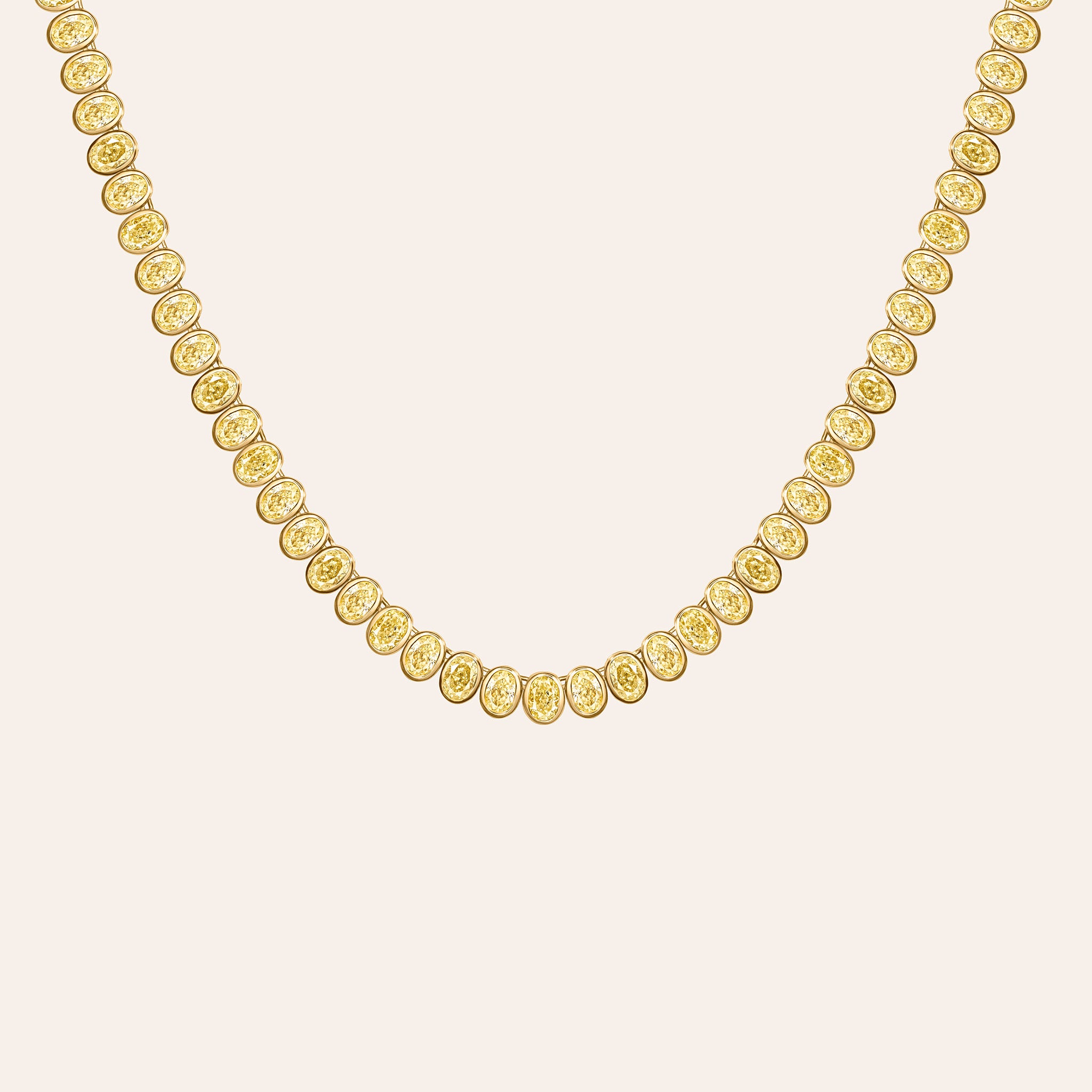 Fancy yellow oval diamond line necklace in 18K yellow gold with bezel-set diamonds in a modern straight silhouette. Close Up.