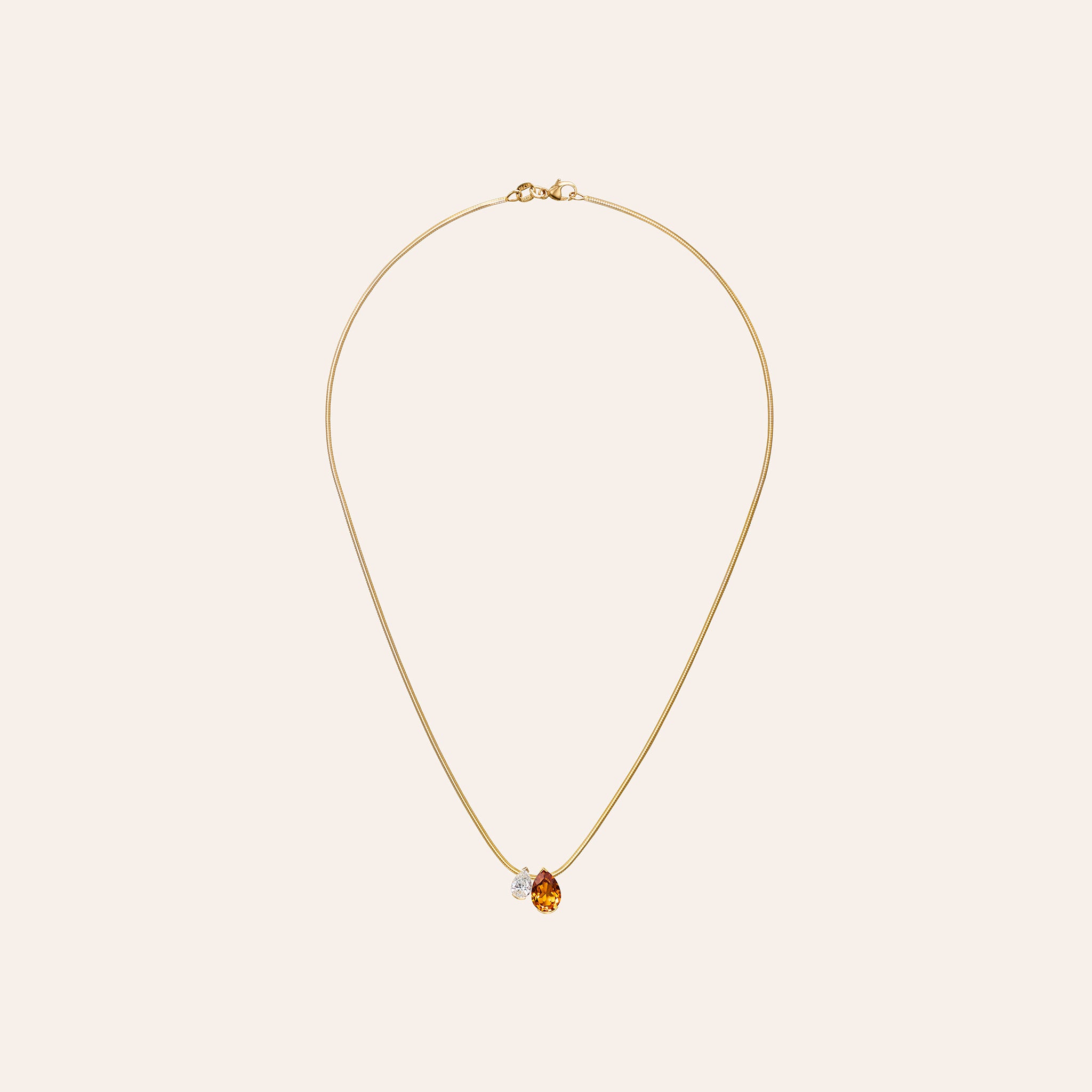 Muse Duo Pendant featuring 1.52-carat pear-shaped citrine and 0.60-carat pear-shaped diamond in 18K yellow gold on a 16-inch snake chain.