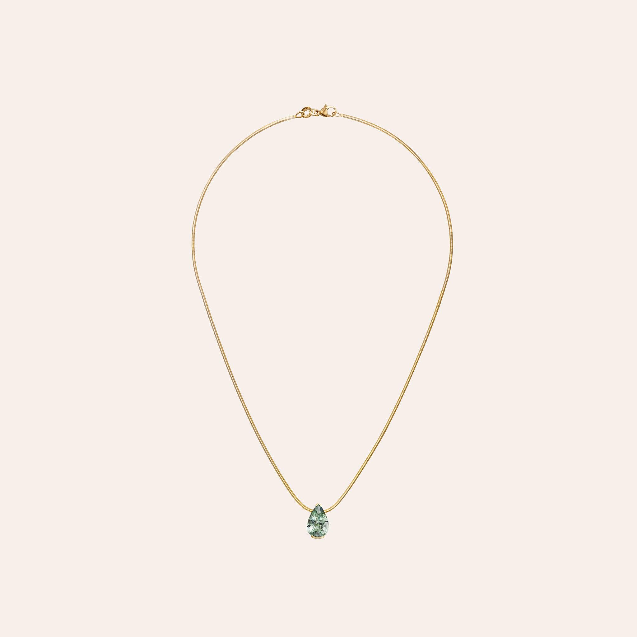 The Green Sapphire Muse Pendant with a 2.06 ct pear-shape green sapphire on an 18k yellow gold snake chain
