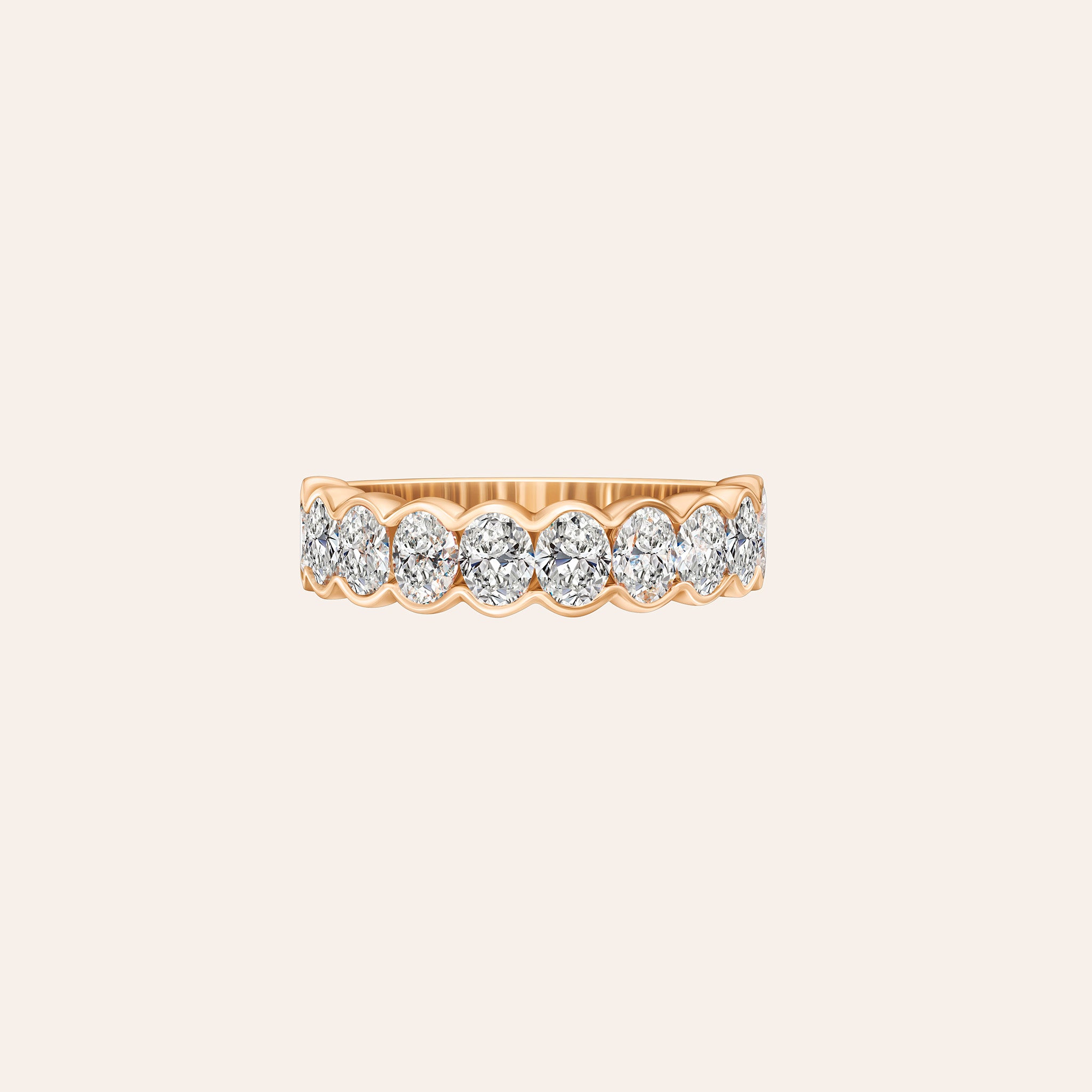 Featuring 2.00 carats of bezel-set oval diamonds, 18K white, yellow and rose gold band