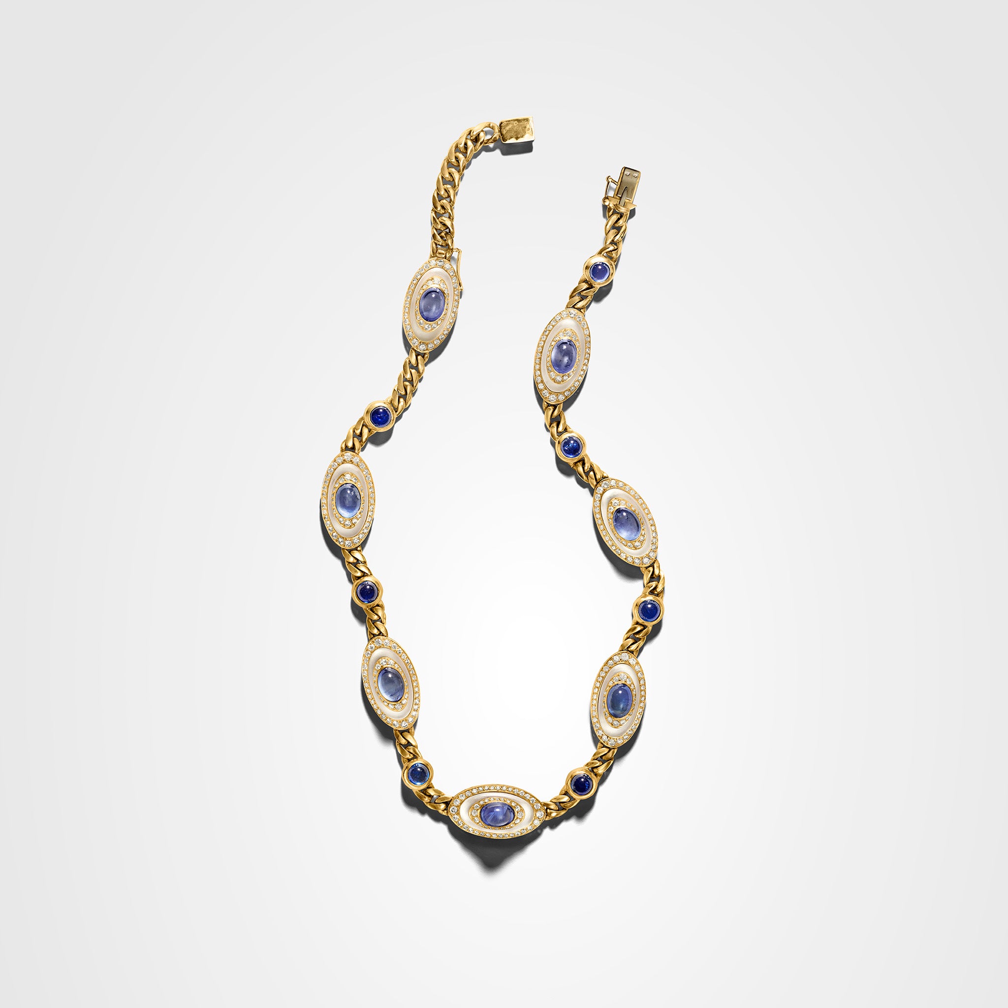 Vintage Bvlgari necklace in 18K yellow gold with carved rock crystal, sapphire, and diamond stations all the way around