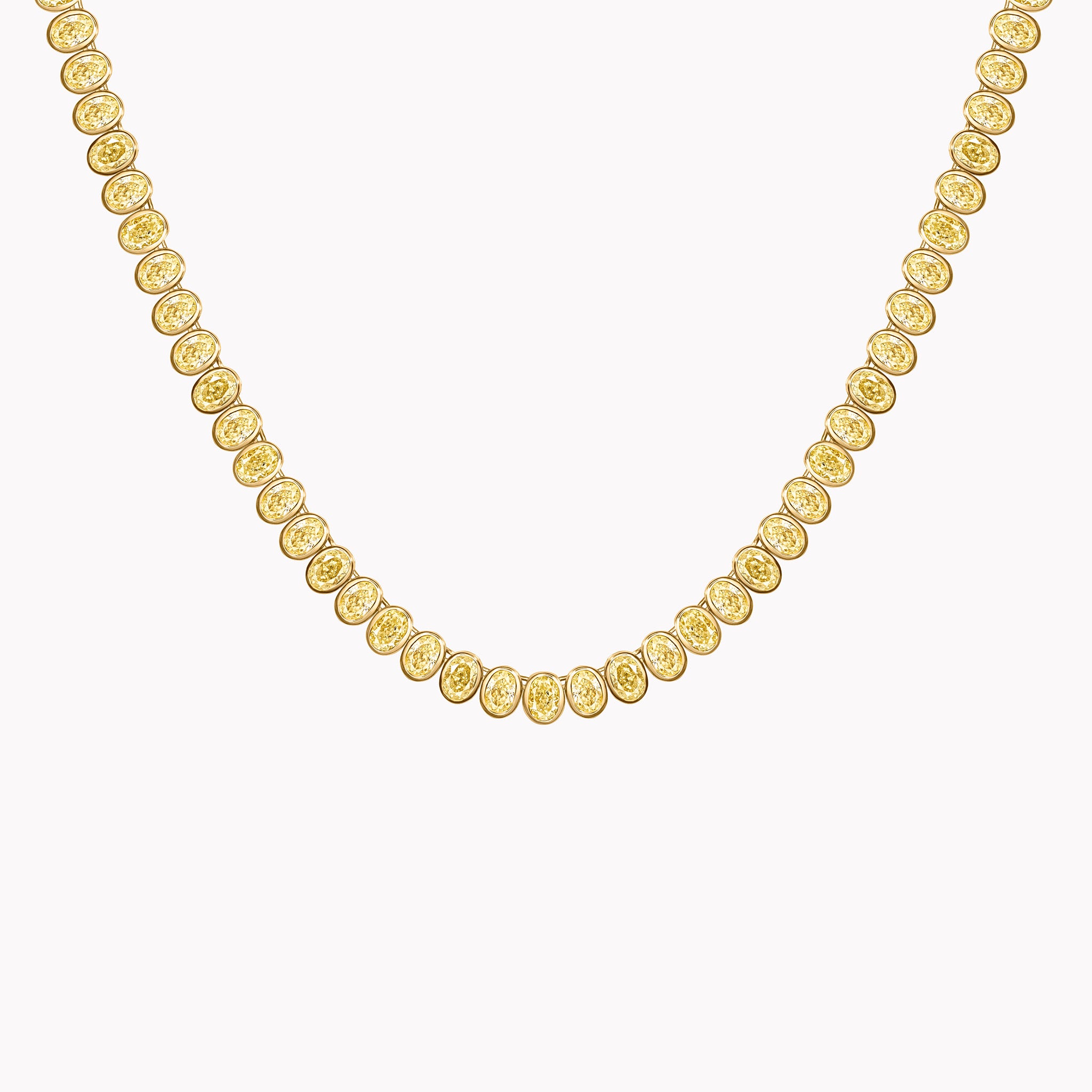 Fancy yellow oval diamond line necklace in 18K yellow gold with bezel-set diamonds in a modern straight silhouette. Close Up.