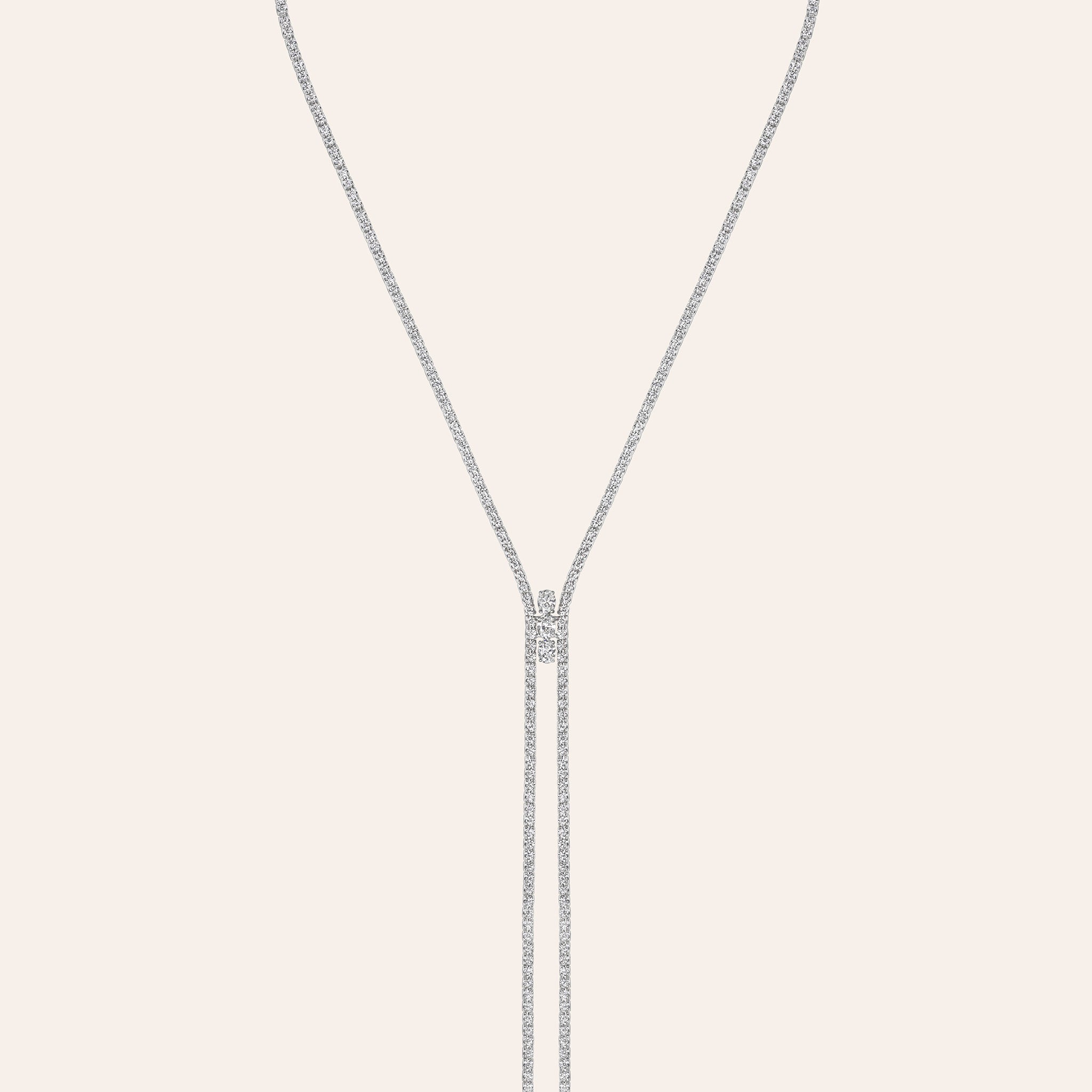 18K white gold diamond bolo necklace with a pavé line and three oval diamonds at the center slide cropped in