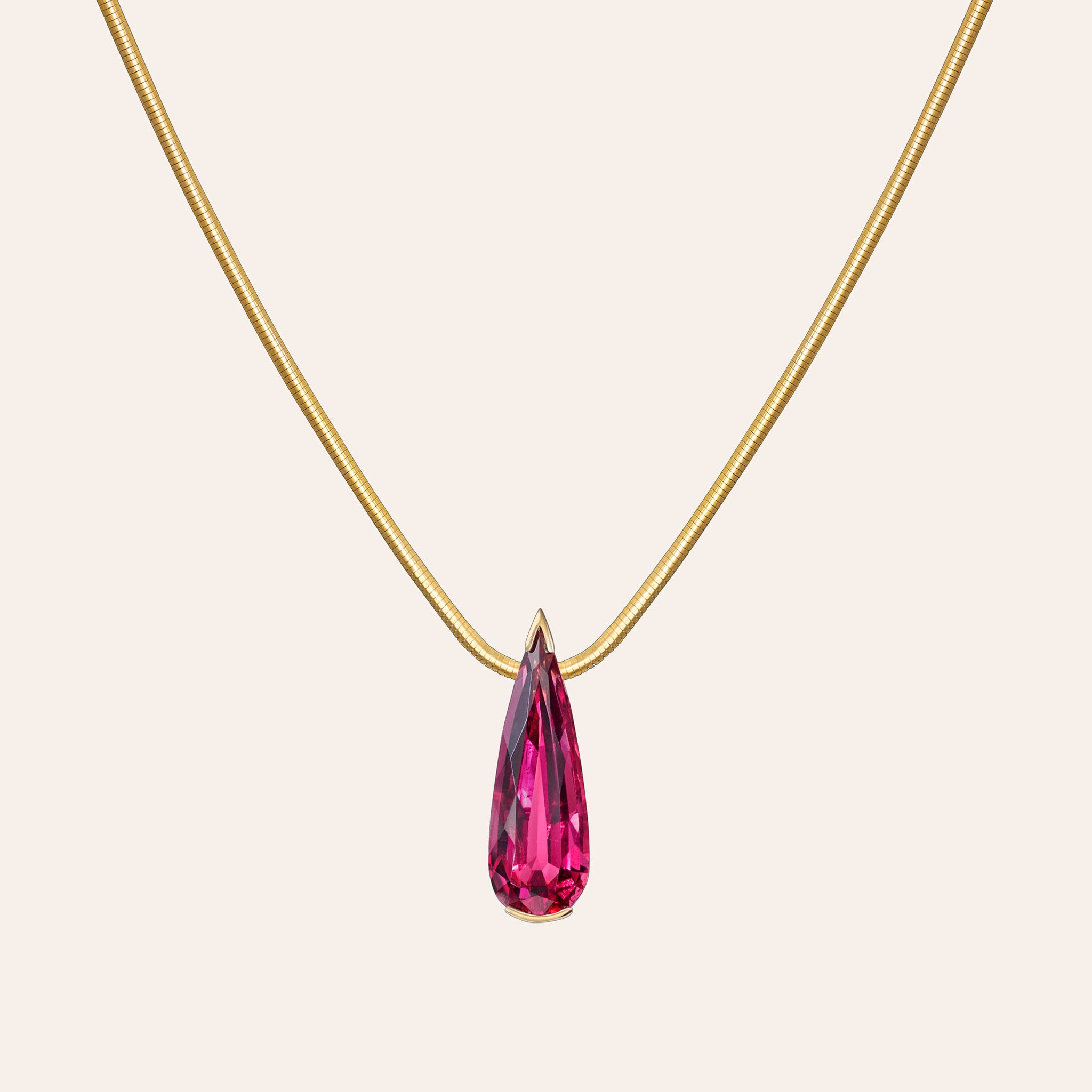 Detail of the Muse Rubellite necklace showing the 11.30 carat rubellite drop set in 18K yellow gold