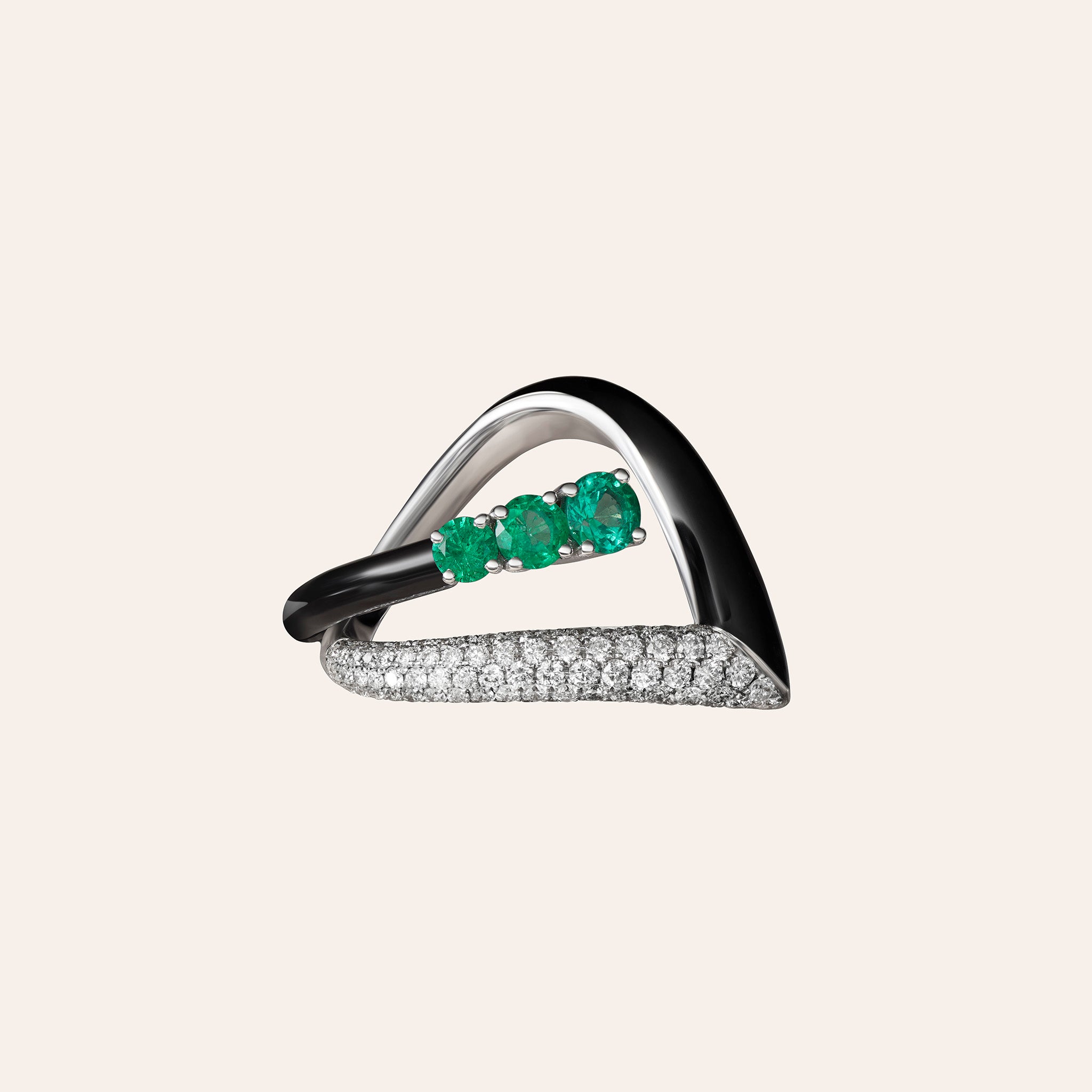Alternate view of the Nikos Koulis Oui Emerald and Diamond Black Enamel Ring in 18K white gold, showing emeralds and diamonds set with black enamel, against a cream background.