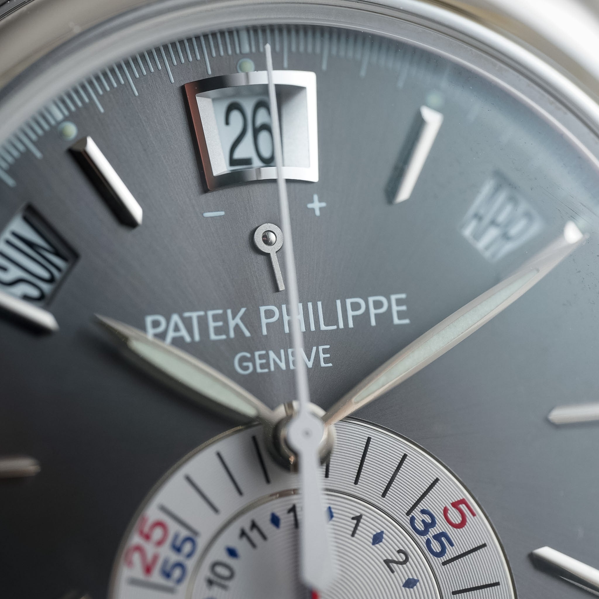 Close-up of a Patek Philippe watch face with detailed design.
