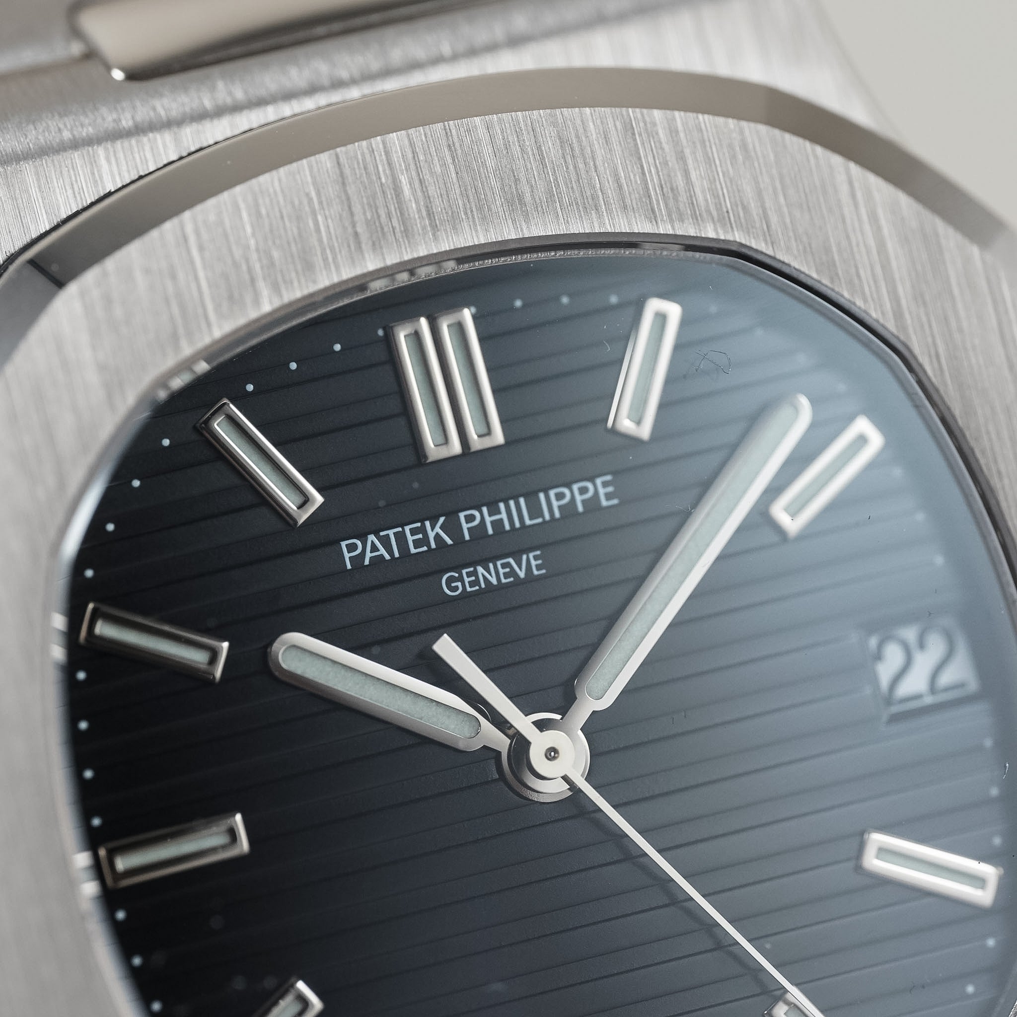 Patek Philippe watch face with silver bezel and black dial