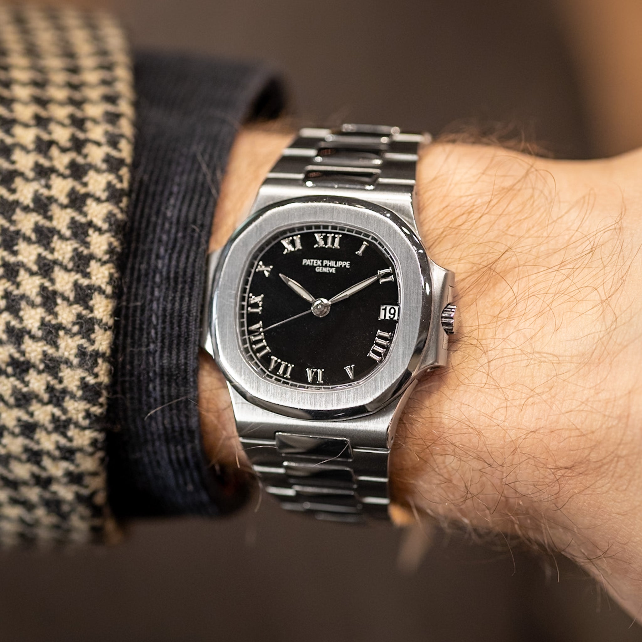 Steel watch on a mans wrist