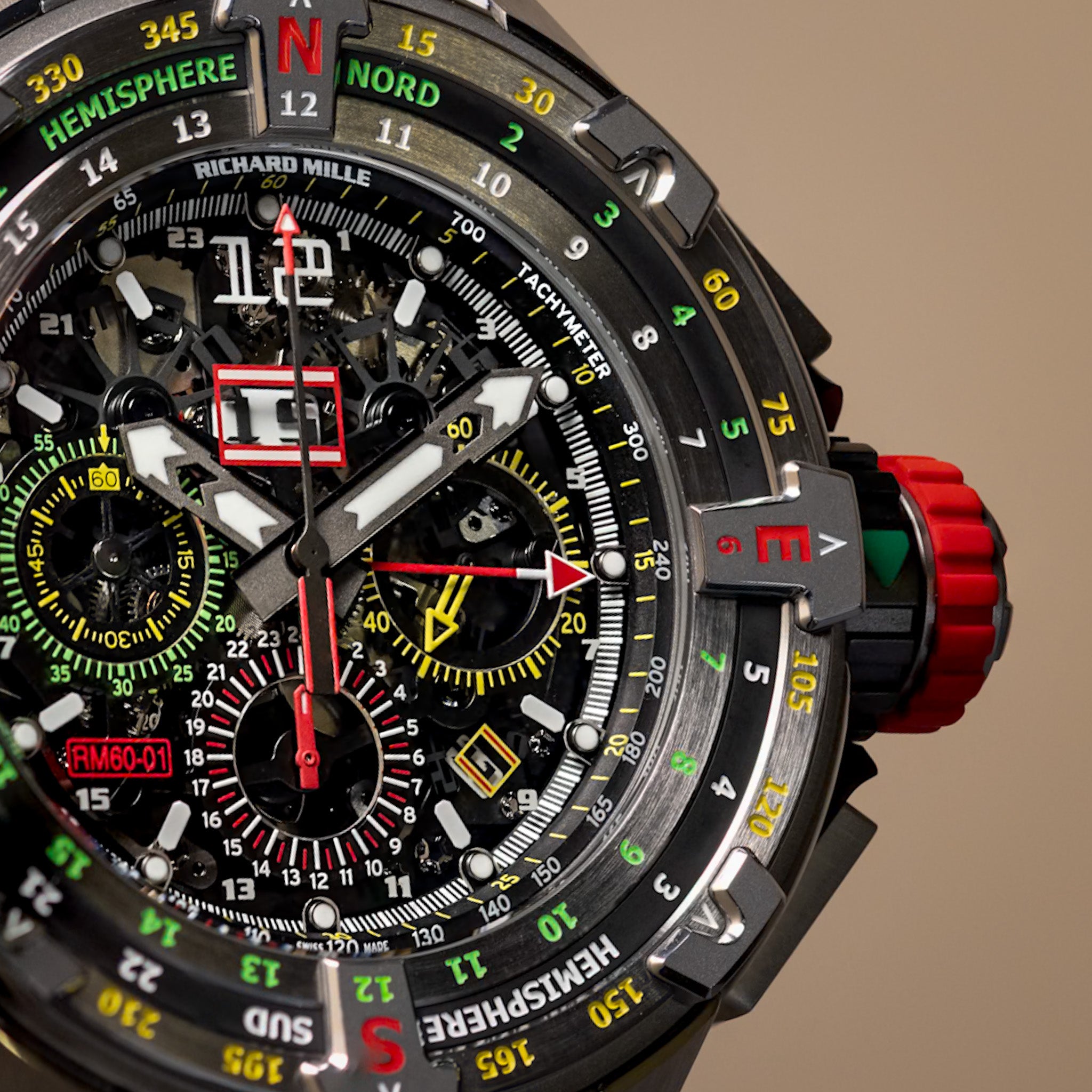 Richard Mille RM60-01 titanium flyback chronograph regatta watch with skeleton dial, rotating compass bezel and rubber strap, front view on white background.