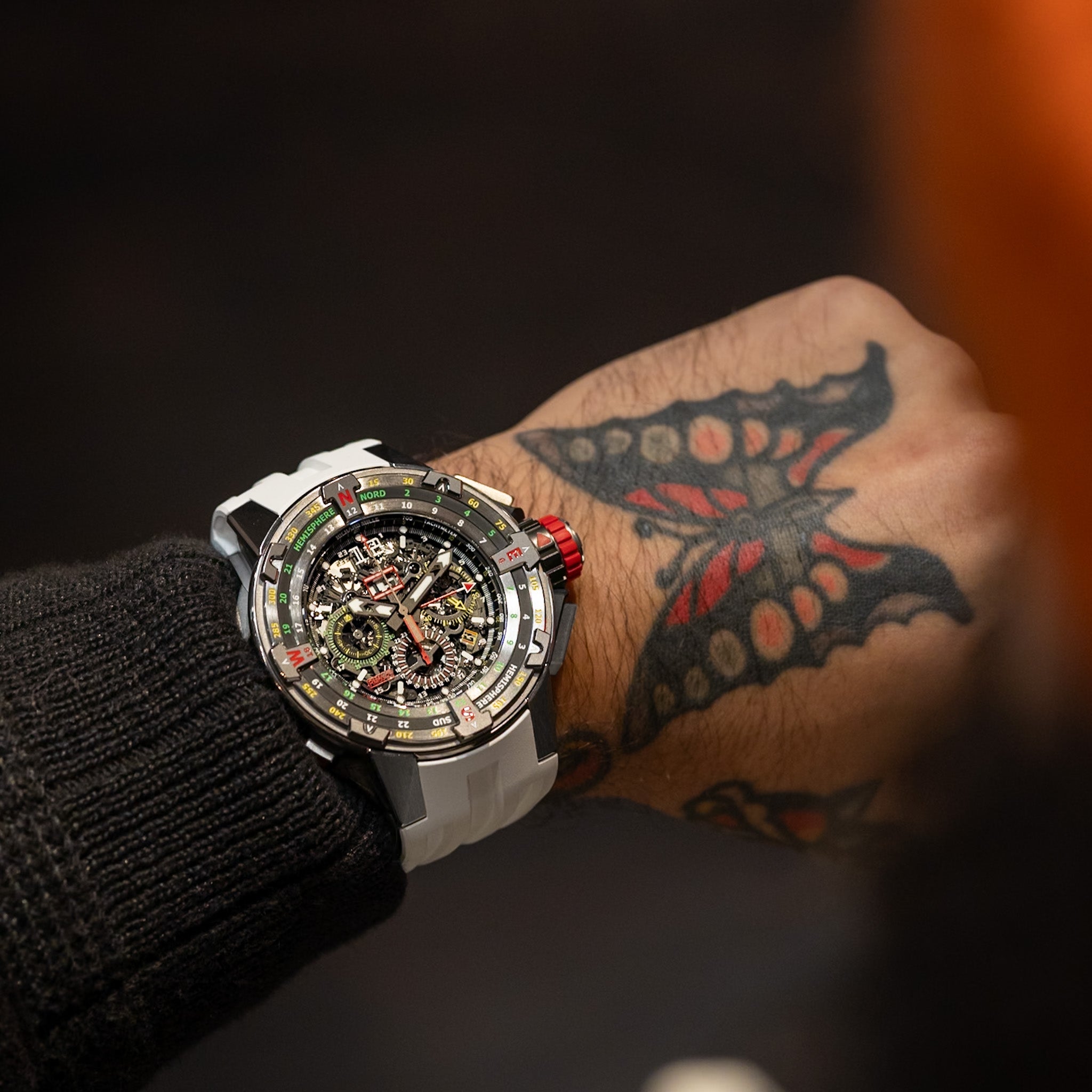 Richard Mille RM60-01 titanium flyback chronograph regatta watch with skeleton dial, rotating compass bezel and rubber strap, front view on white background.