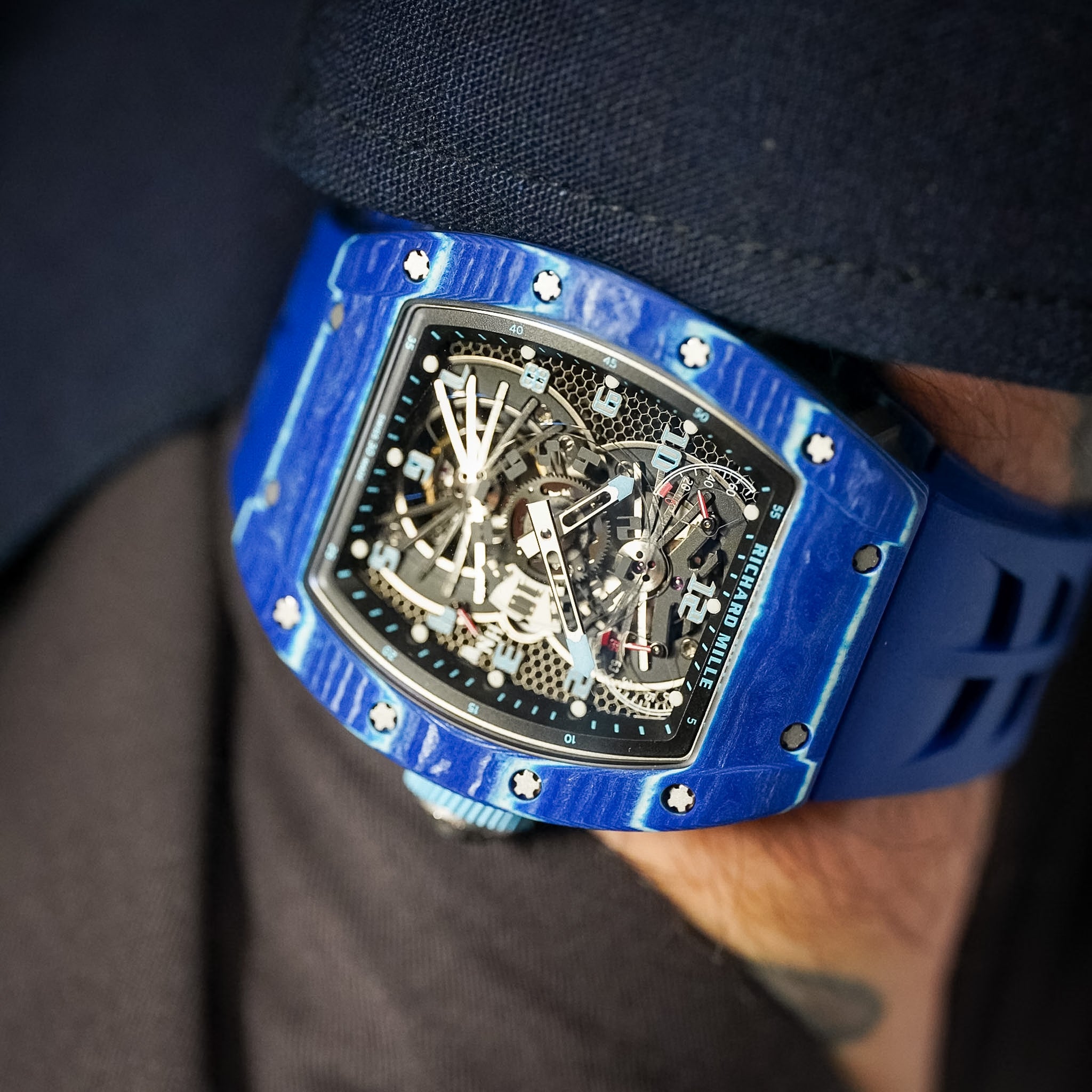 blue luxury watch on a man's wrist