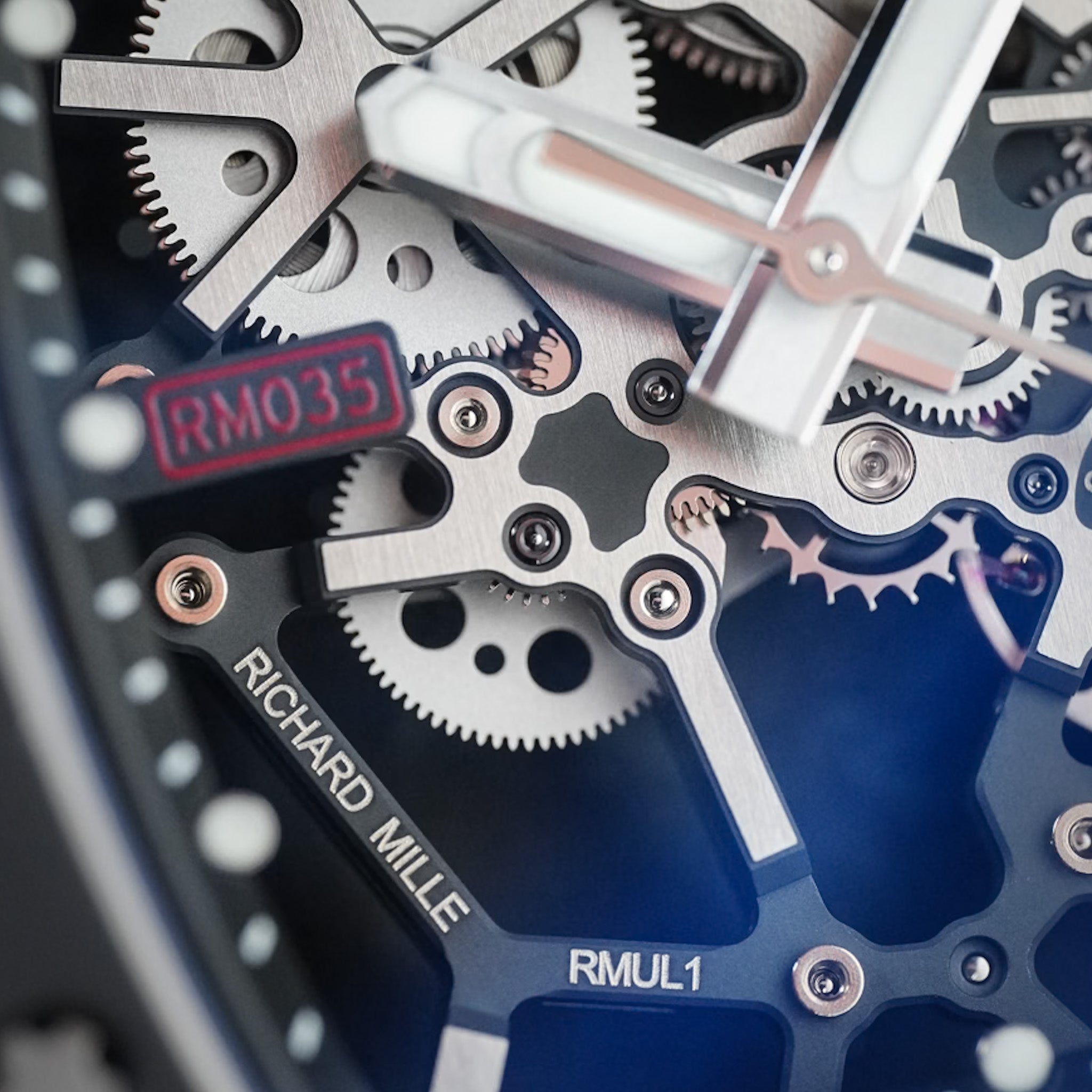 Close up shot of a Richard Mille watch movement showing the gears and bridges in detail